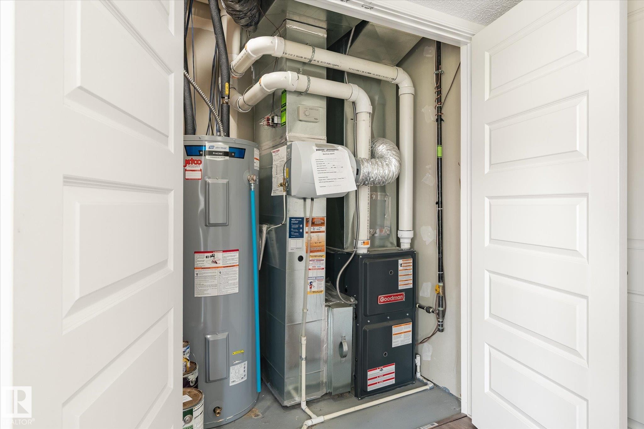 Utility closet housing a water heater and HVAC system - 47 330 Bulyea Road, Edmonton, AB - Indoor Photo Showing Basement