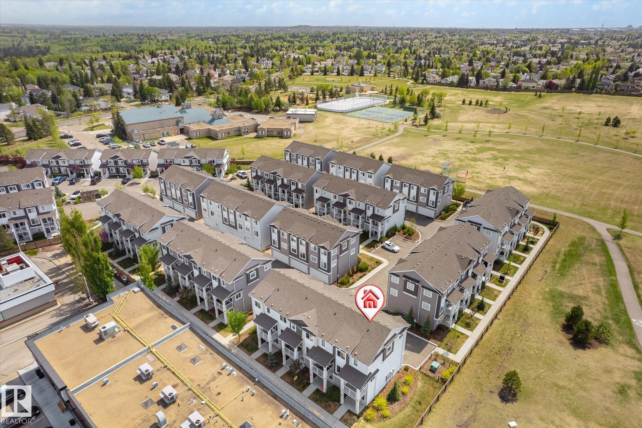 Contemporary townhouse development featuring multi-story units with private balconies and attached garages - 47 330 Bulyea Road, Edmonton, AB - With View