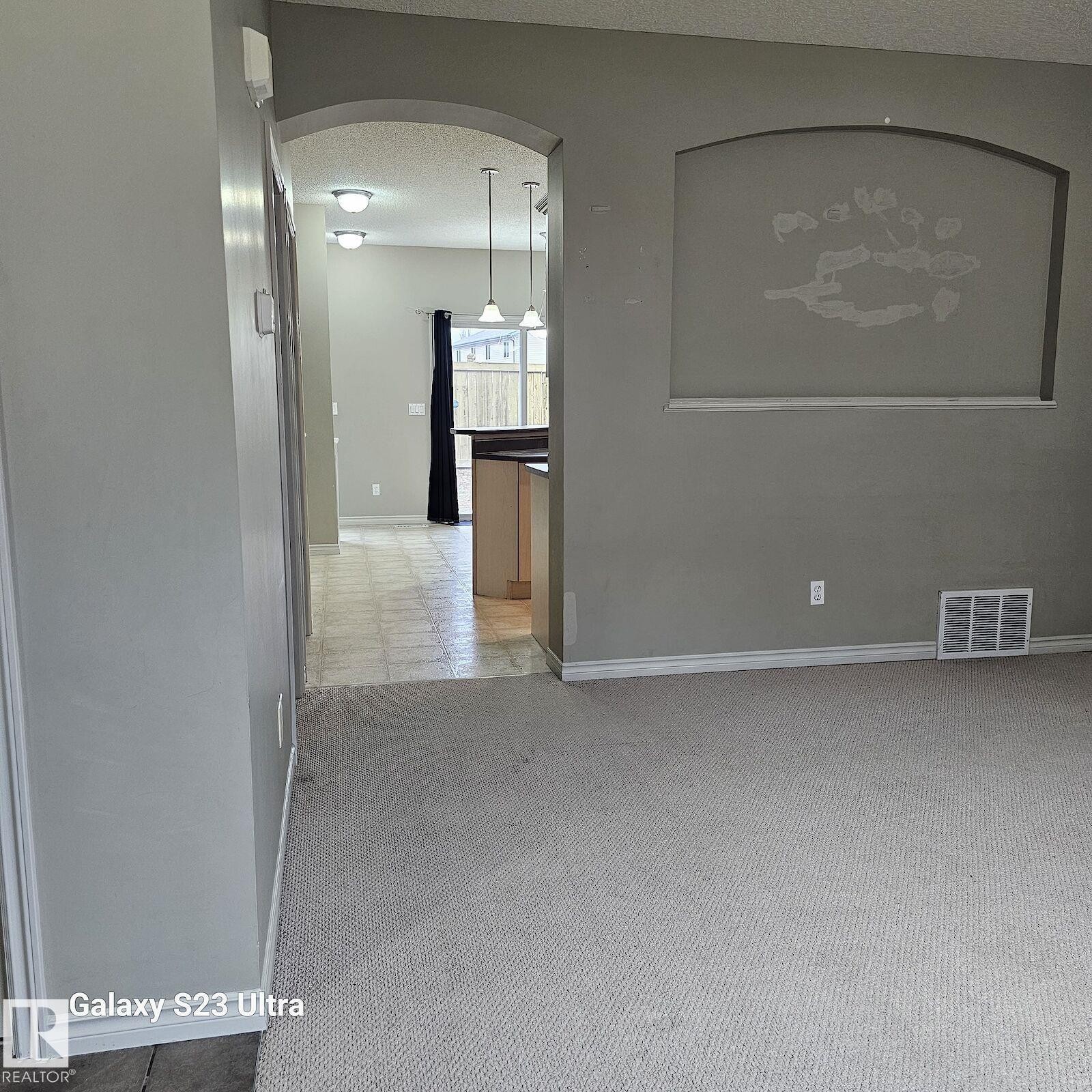 Archway entry to additional living spaces - 99 13825 155 Avenue, Edmonton, AB