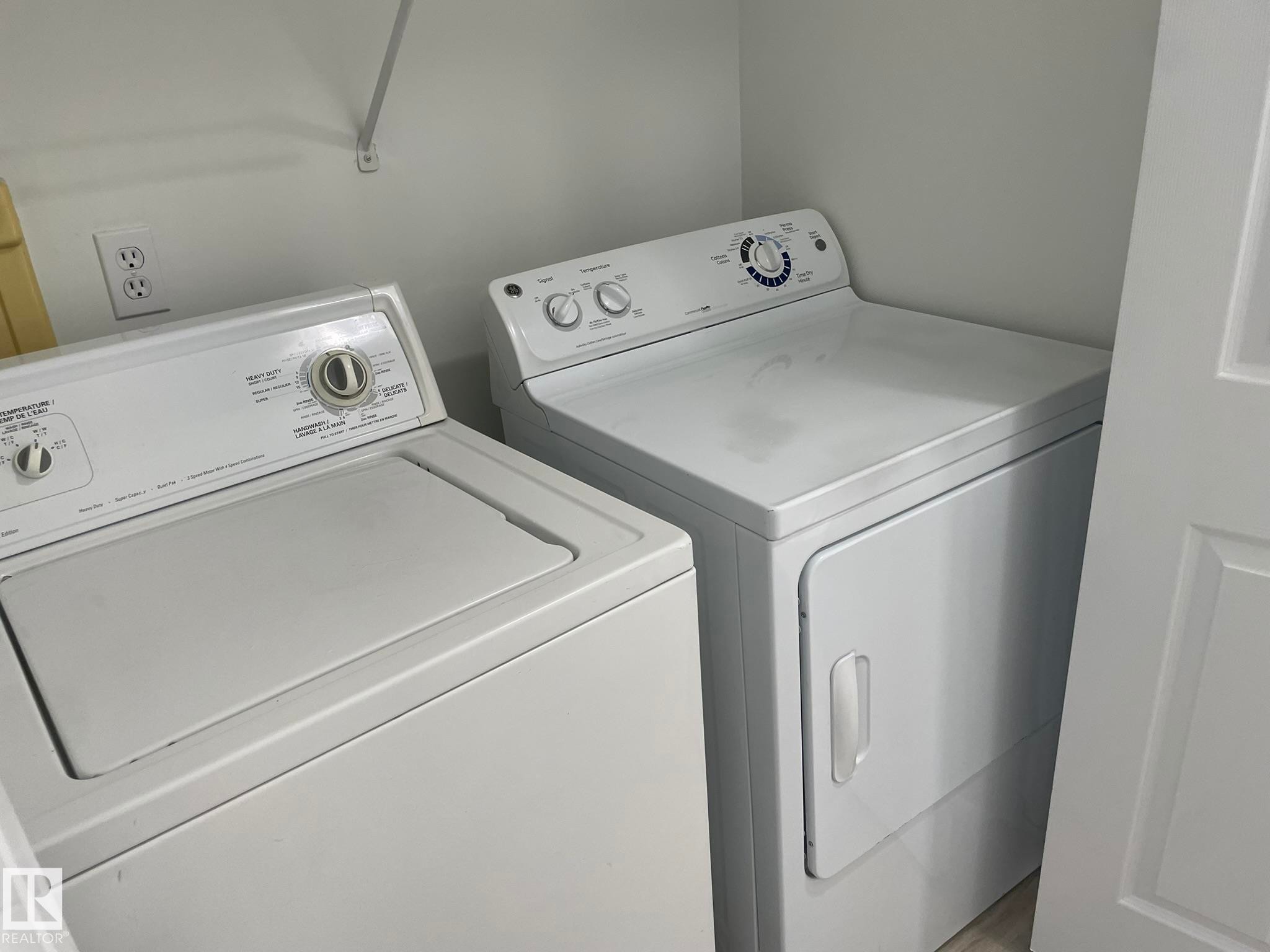 Dedicated laundry area featuring a white top-load washing machine and a white electric dryer - 2 1295 Carter Crest Road, Edmonton, AB - Indoor Photo Showing Laundry Room