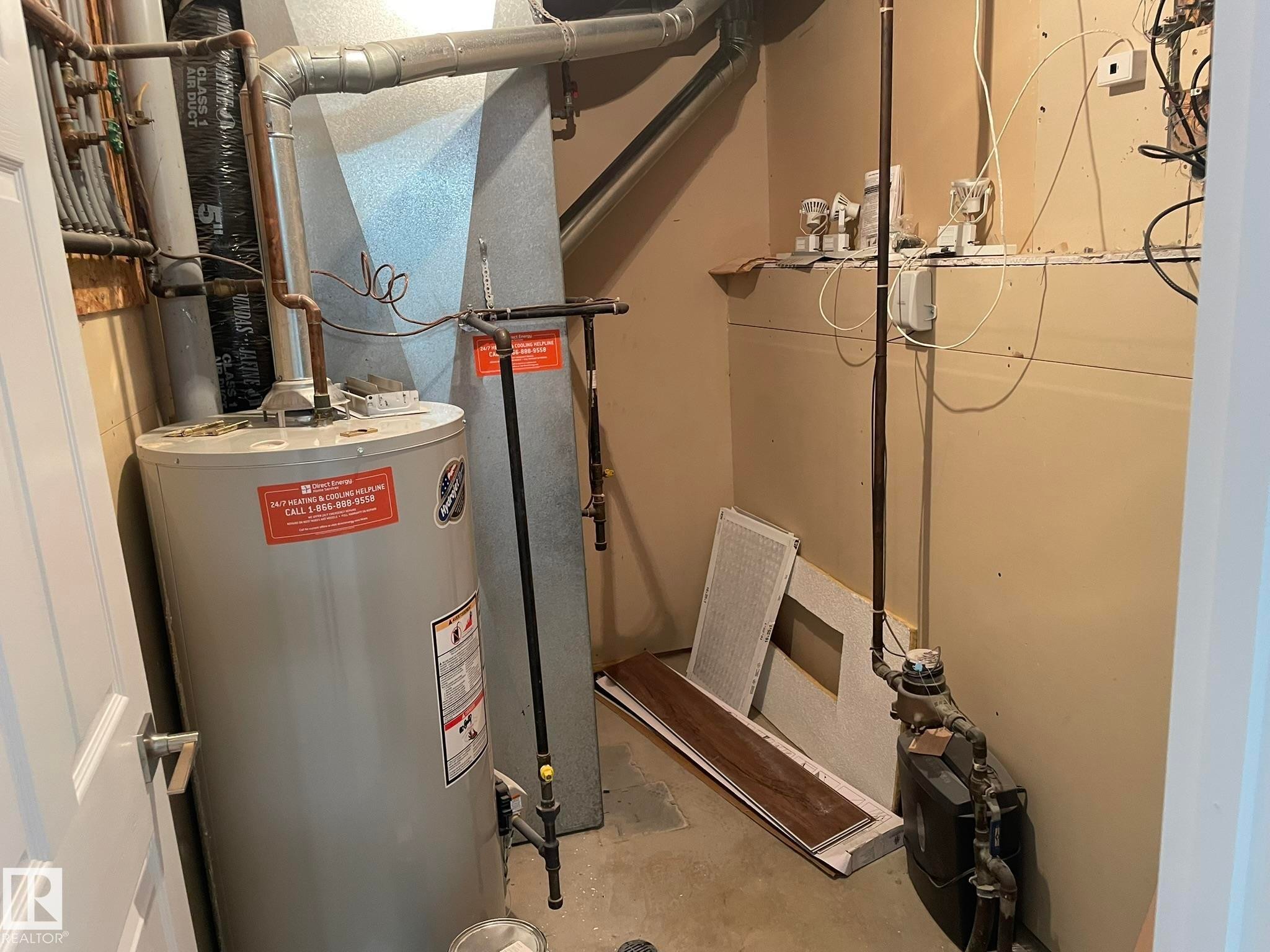 Utility closet featuring a water heater, furnace, and exposed piping - 2 1295 Carter Crest Road, Edmonton, AB - Indoor Photo Showing Basement