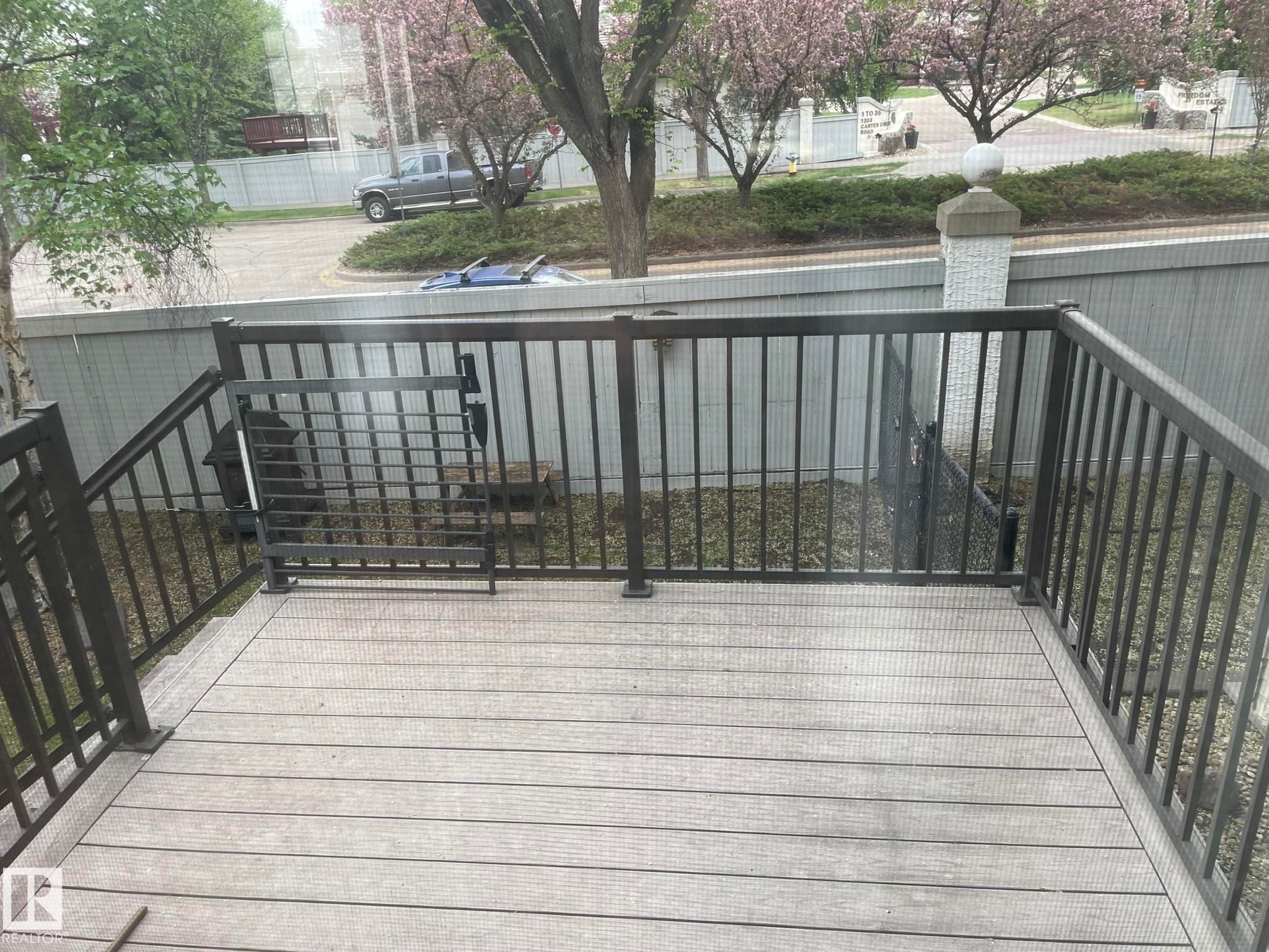 Composite deck with dark metal railings and gate - 2 1295 Carter Crest Road, Edmonton, AB - Outdoor With Exterior