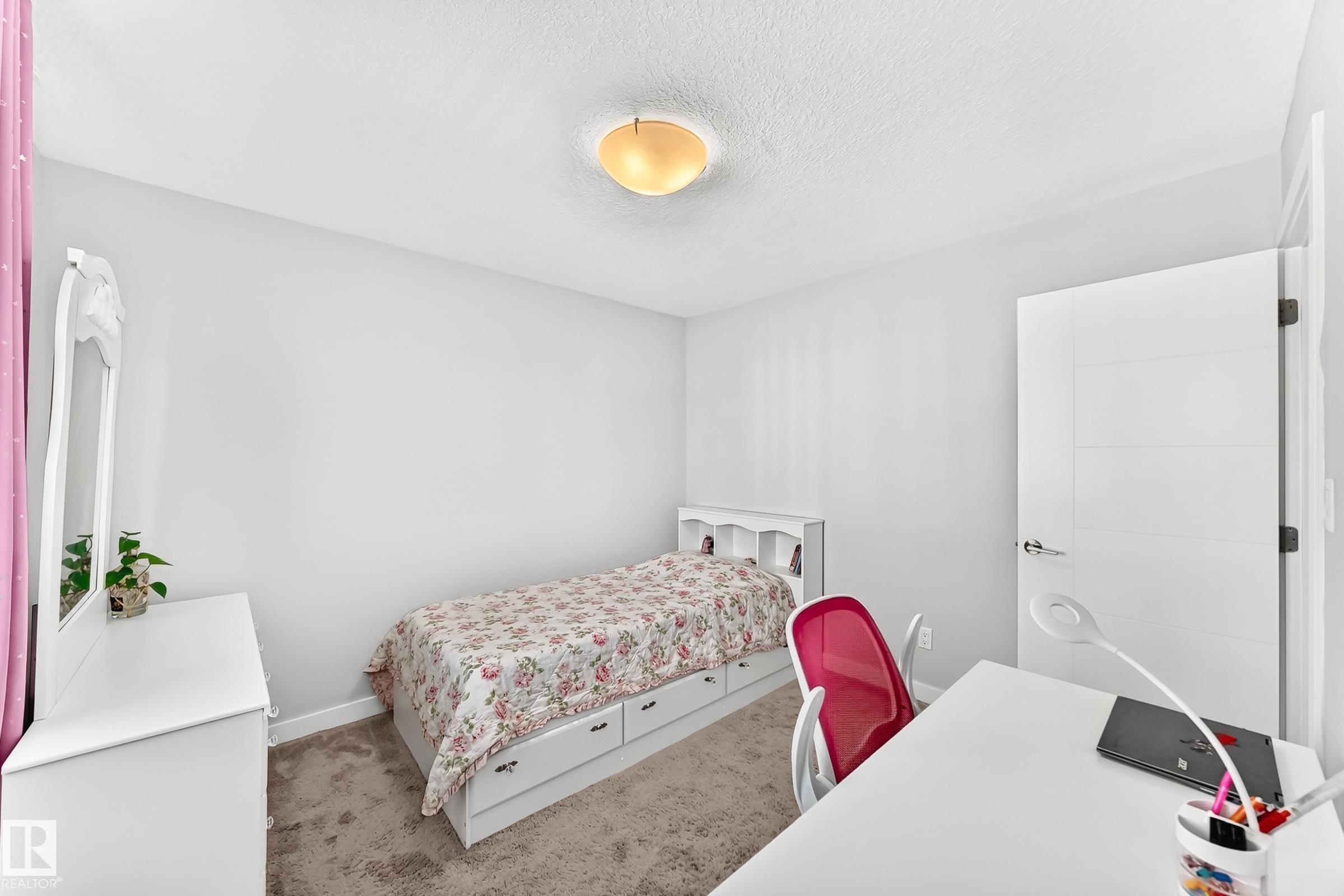 Bright interior space featuring light gray walls and a textured ceiling - 3672 Claxton Place Sw, Edmonton, AB
