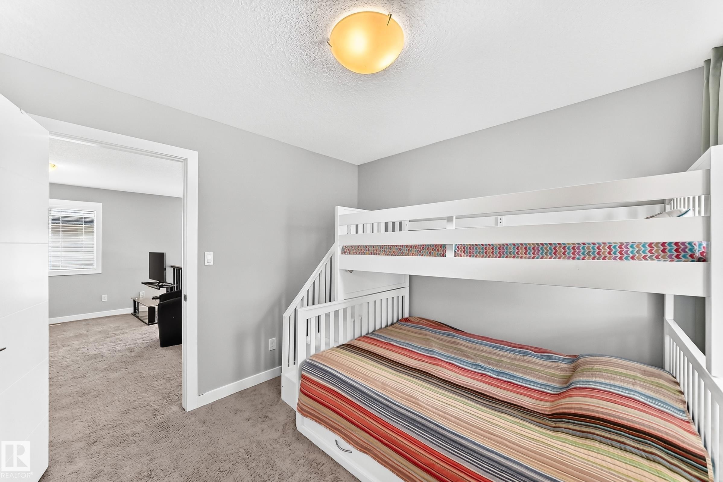Room featuring neutral gray wall paint and light-colored carpet - 3672 Claxton Place Sw, Edmonton, AB