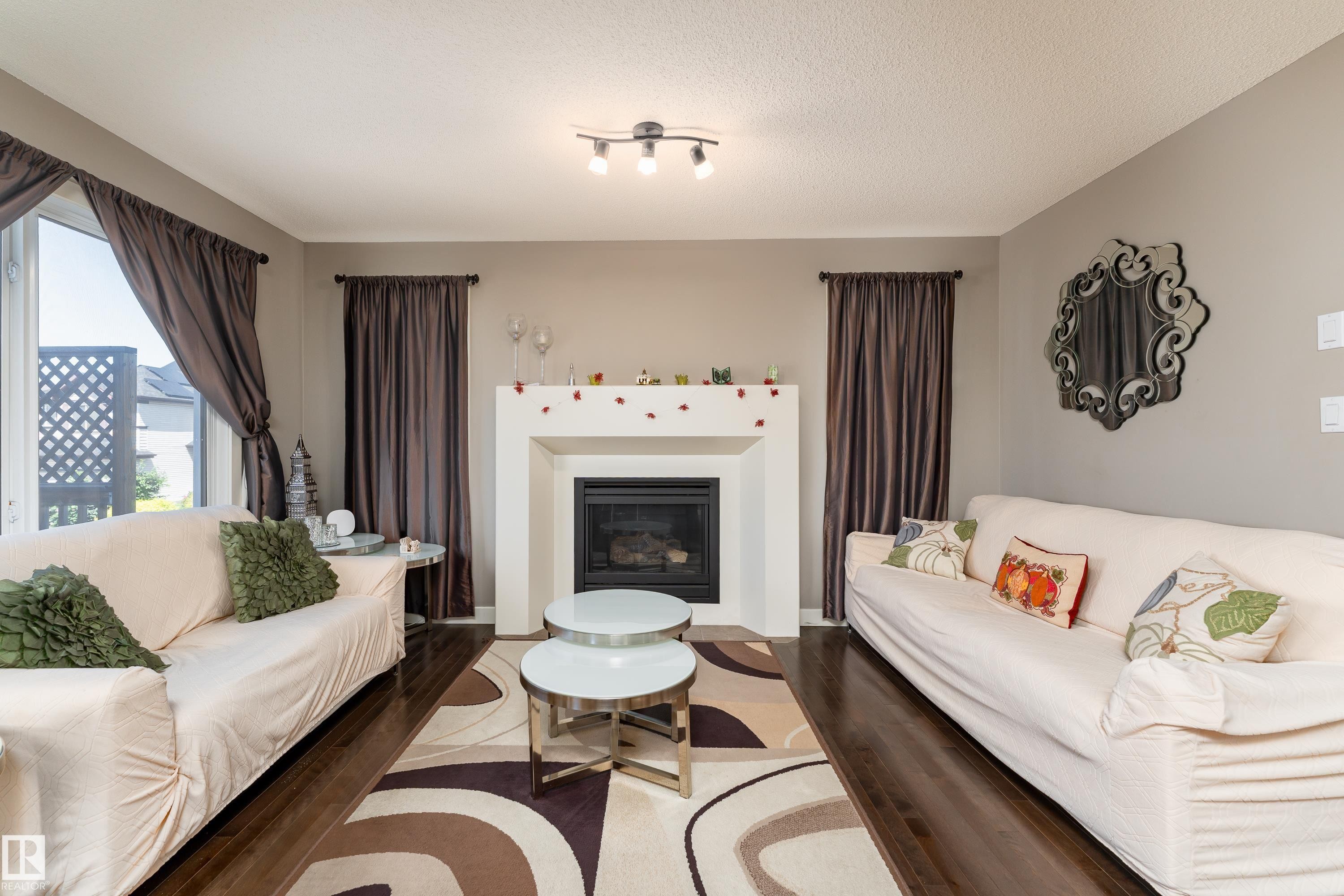 512 59 Street Sw, Edmonton, AB - Indoor Photo Showing Living Room With Fireplace