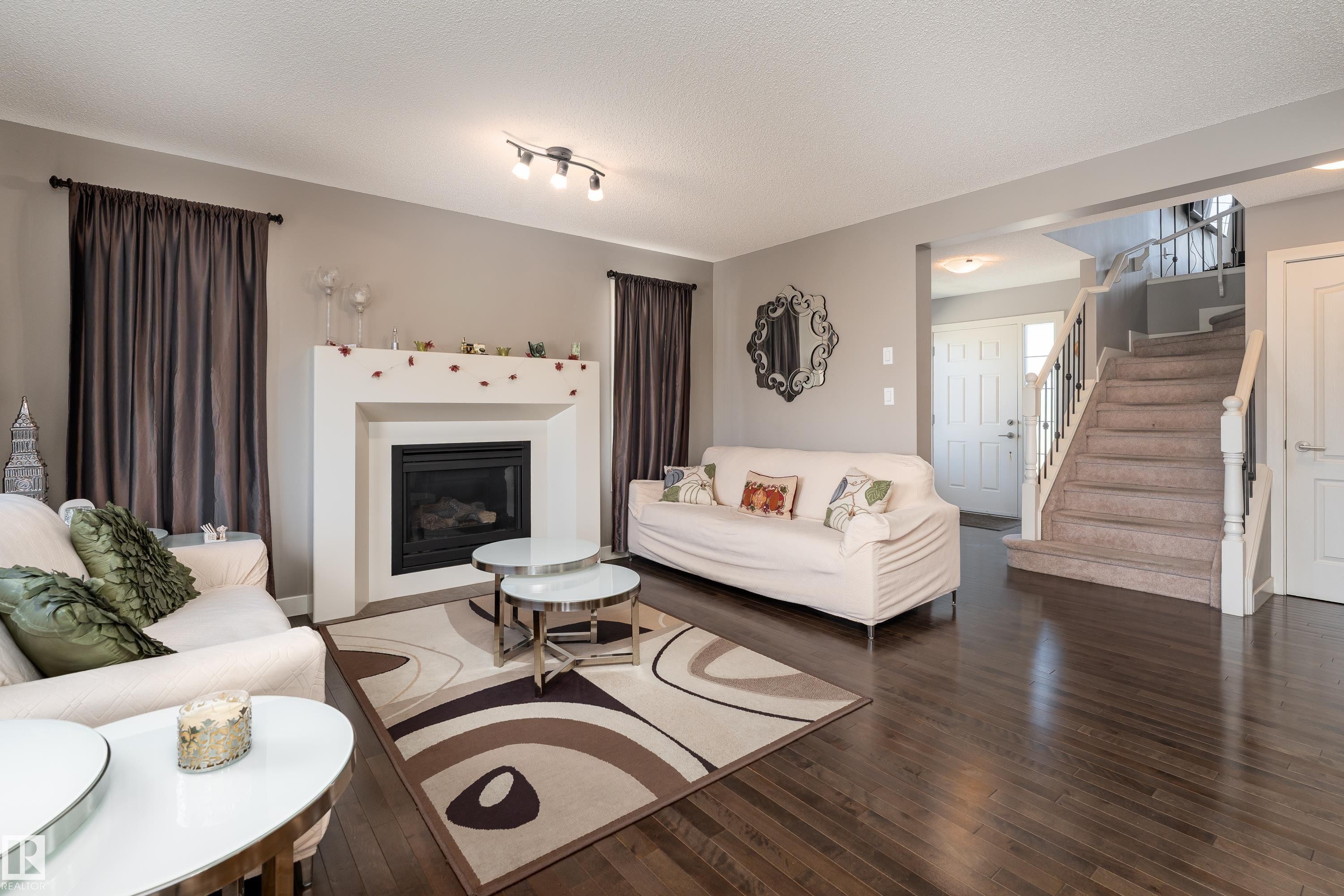 512 59 Street Sw, Edmonton, AB - Indoor Photo Showing Living Room With Fireplace