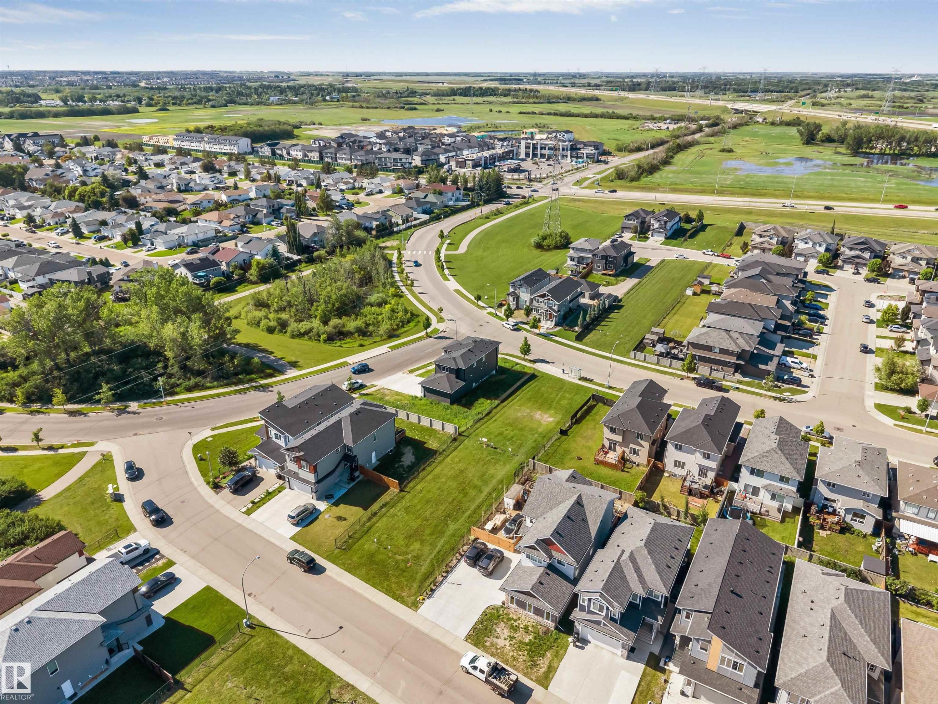 Aerial perspective highlighting a residential development with varied housing styles - 5512 150 Avenue, Edmonton, AB