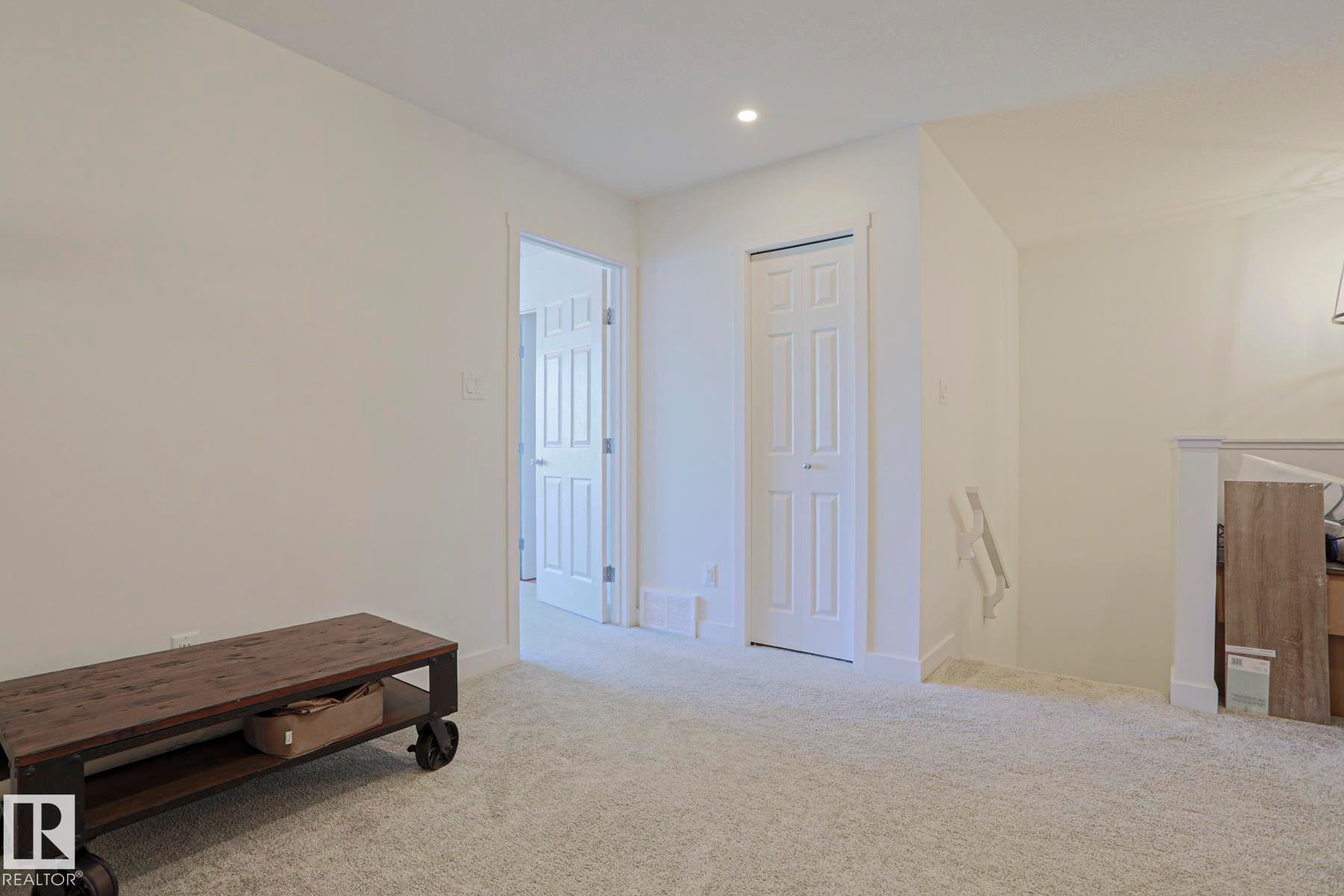 Carpeted room with recessed lighting and white painted walls - 33 Eton Link, Spruce Grove, AB