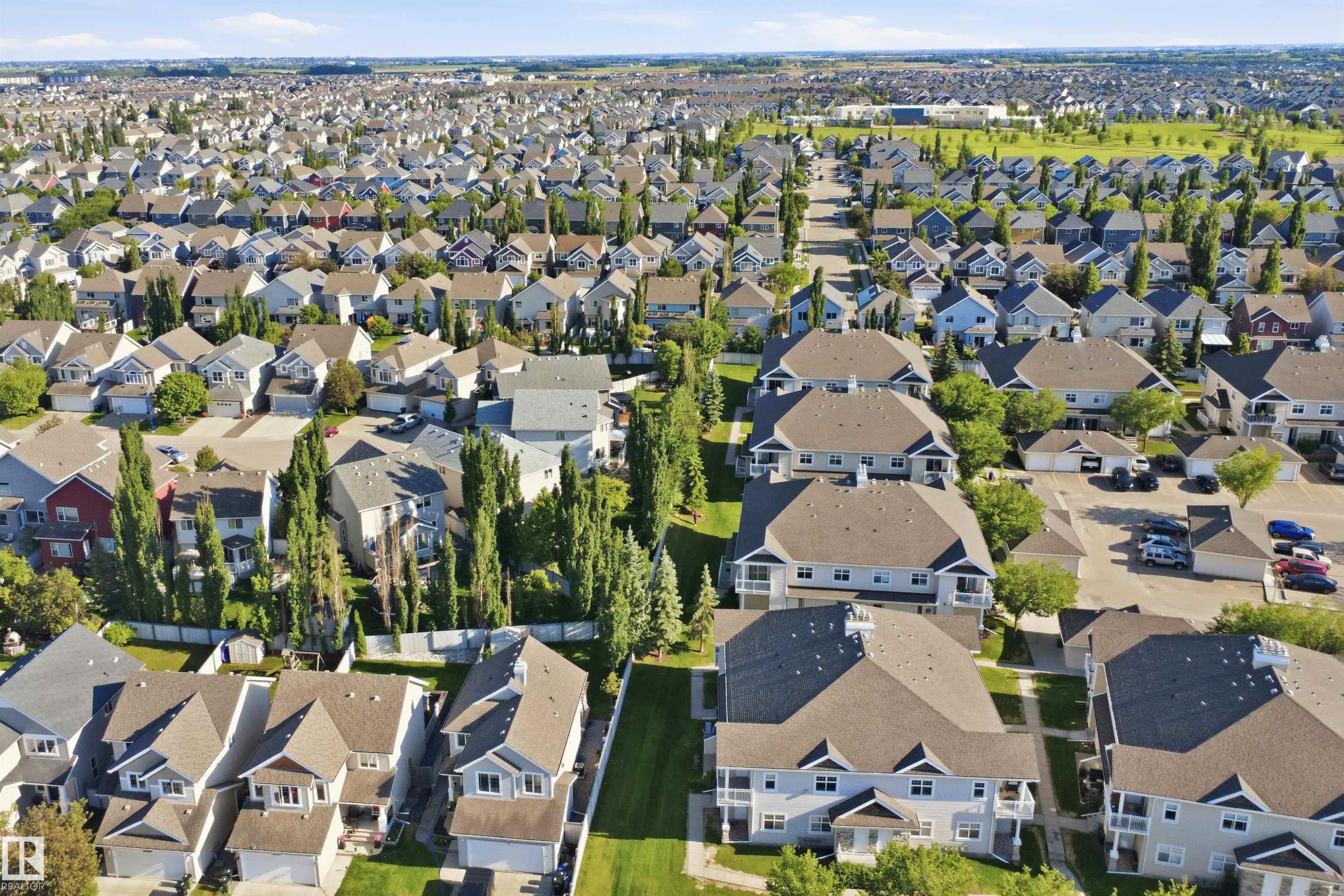 Aerial perspective showcasing a residential area with varied housing types - 95 3040 Spence Wynd, Edmonton, AB