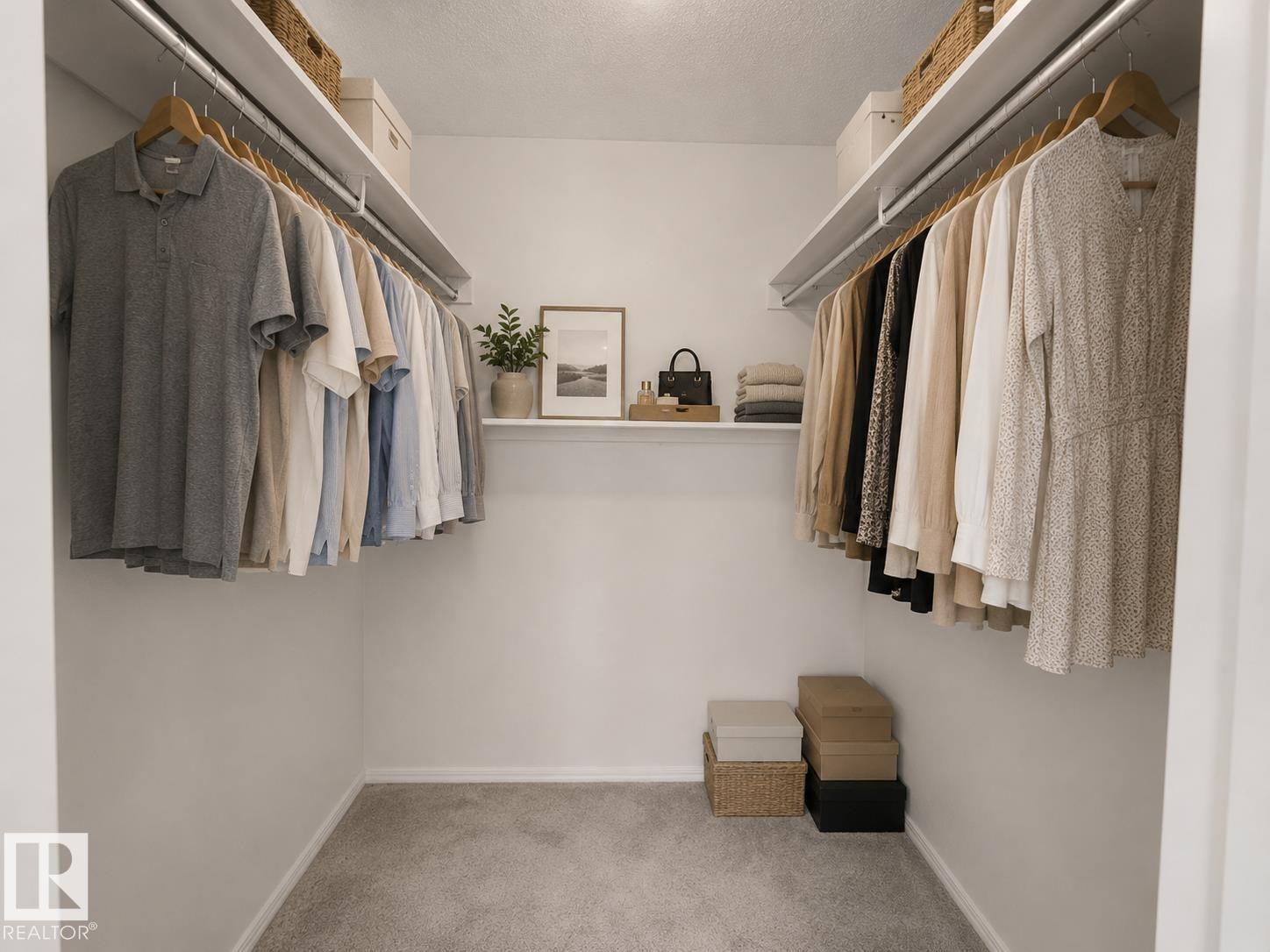 Walk-in closet featuring white walls, gray carpeting, and integrated shelving with hanging rods - 1855 Mill Woods Rd E Nw, Edmonton, AB