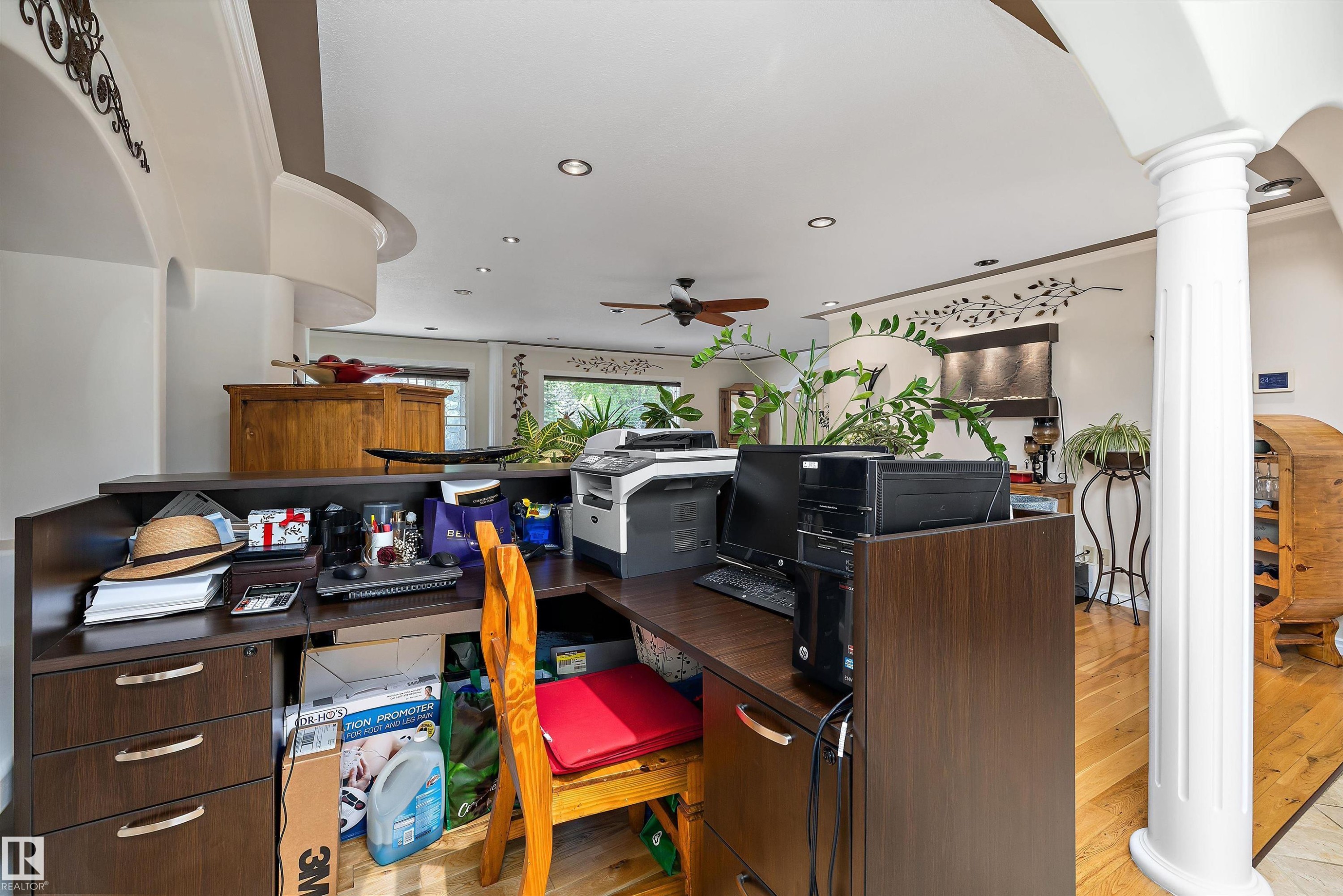 Built-in dark wood-finish desk with integrated cabinetry - 11124 110A Avenue Nw, Edmonton, AB