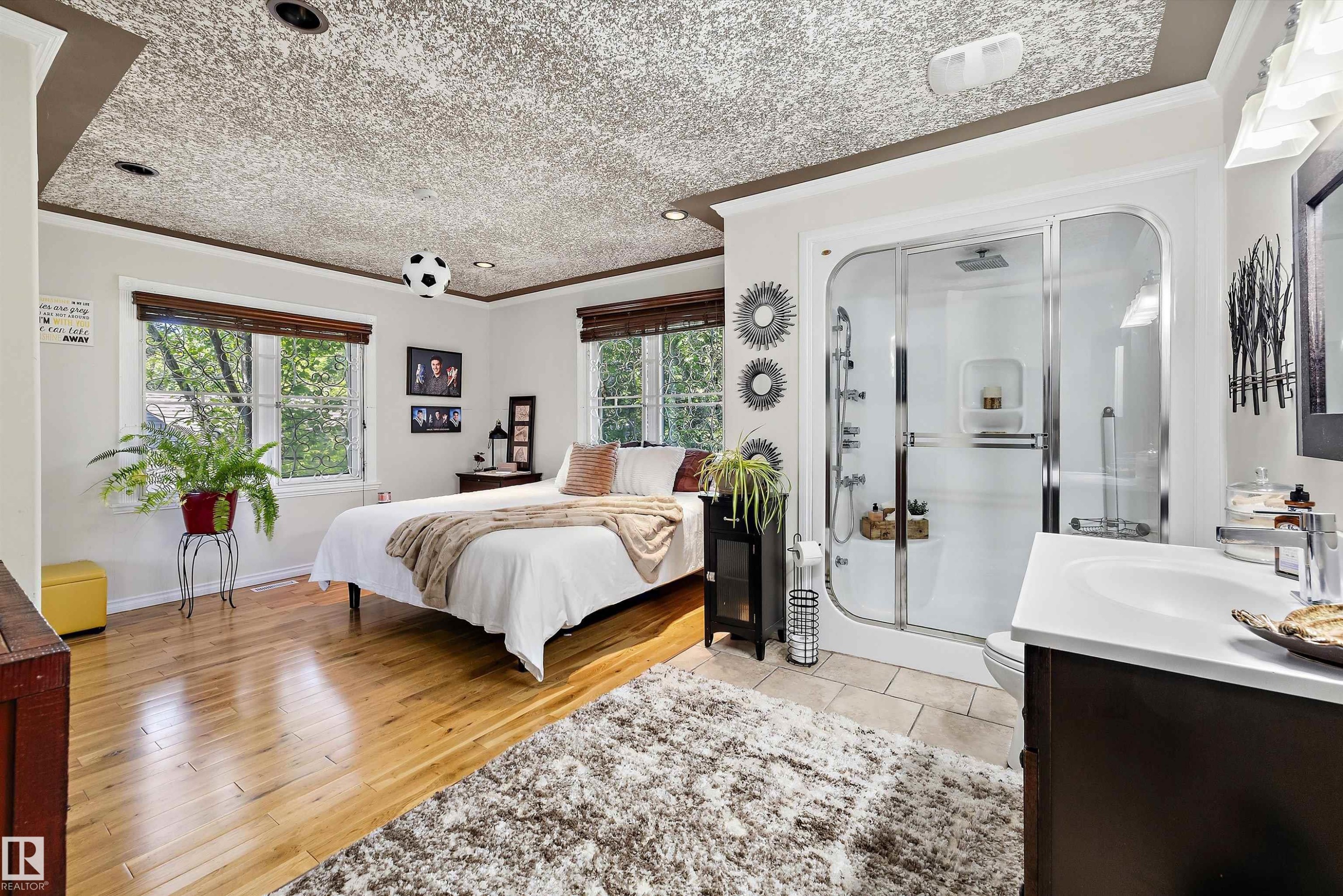 Integrated full bathroom featuring a glass-enclosed shower with multiple showerheads - 11124 110A Avenue Nw, Edmonton, AB