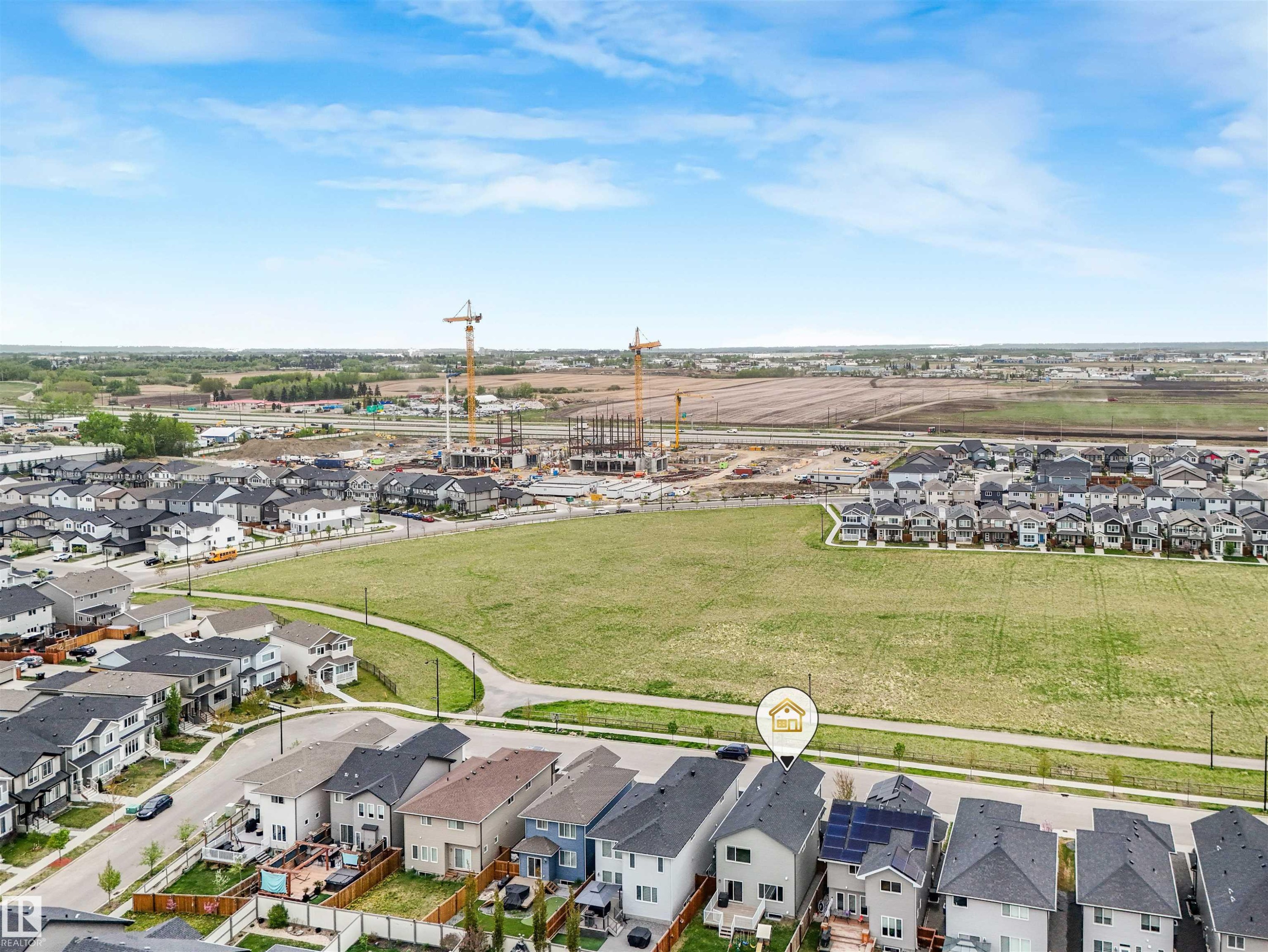 Residential property with a dark shingle roof and solar panels - 20507 99 Avenue, Edmonton, AB - Outdoor With View