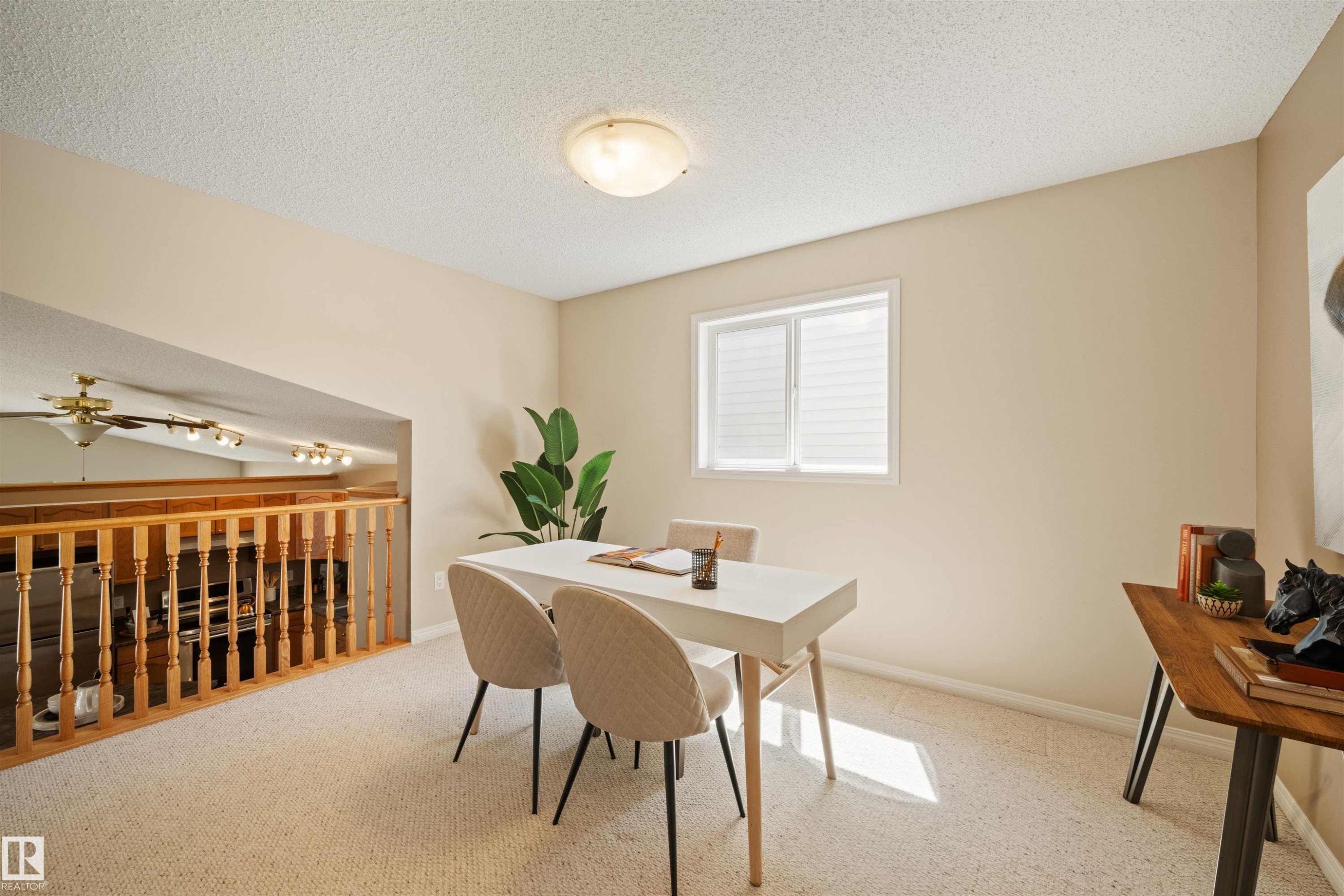 Loft area featuring neutral carpeting and a white trim window with blinds - 7838 Schmid Place Nw, Edmonton, AB - Indoor