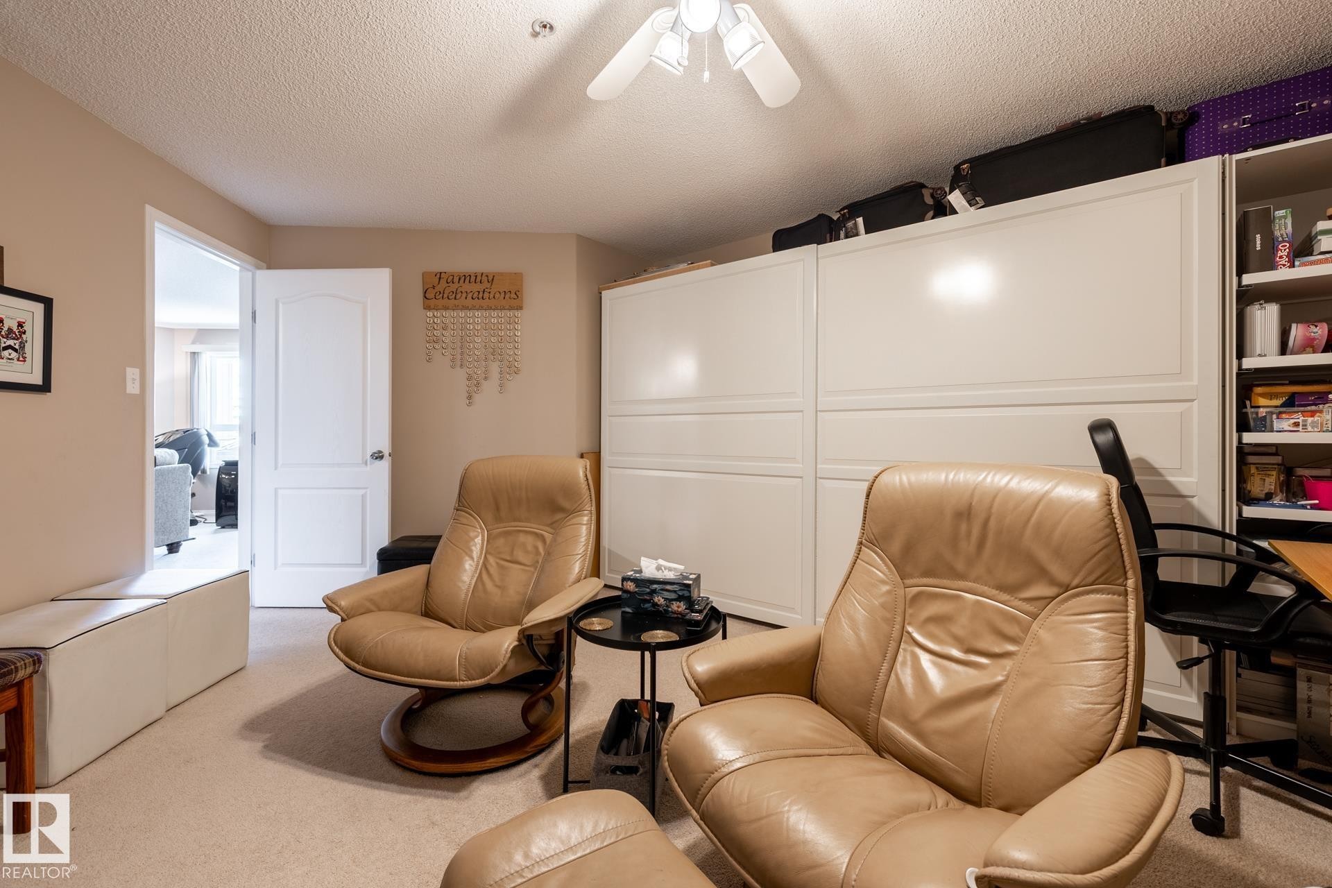 Neutral tone wall paint, textured ceiling, and a ceiling fan with light fixture - 330 1520 Hammond Gate Gate, Edmonton, AB