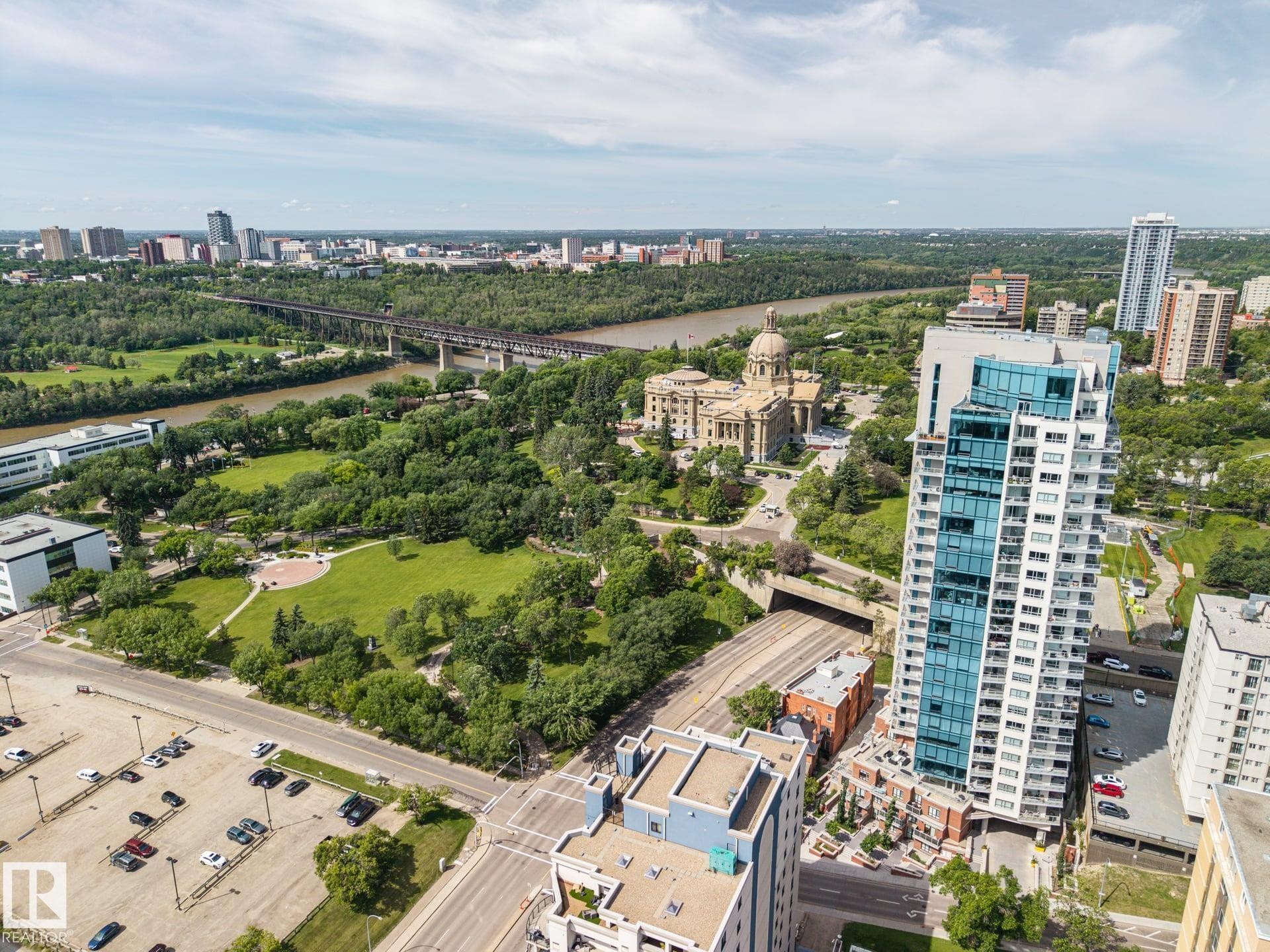 Contemporary high-rise building featuring a sleek glass facade and private balconies - #802 9720 106 St Nw, Edmonton, AB - Outdoor With View