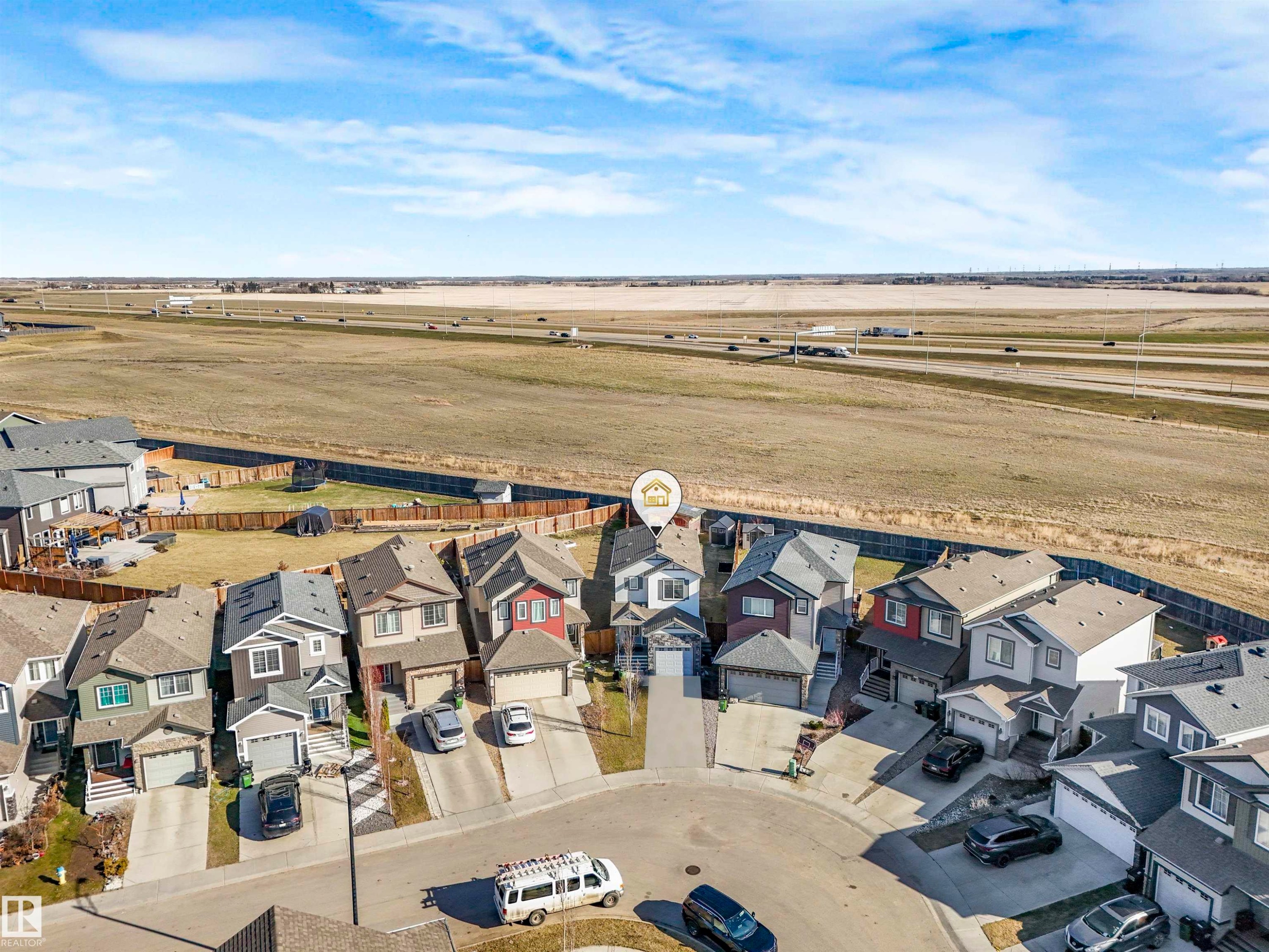 Aerial perspective showcasing a residential development with a mix of siding and shingle roofs - 17171 38 Street, Edmonton, AB