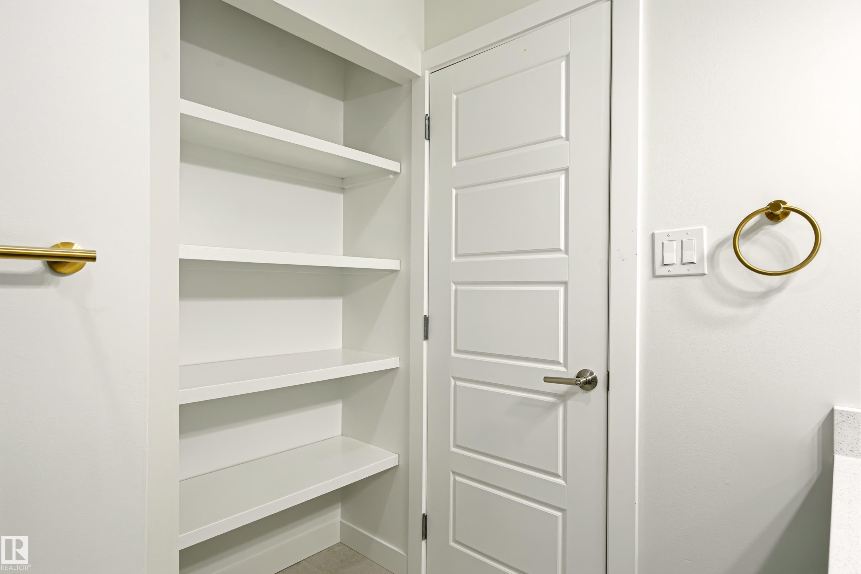Built-in open shelving with multiple tiers provides ample storage - 18217 84 Avenue Nw, Edmonton, AB