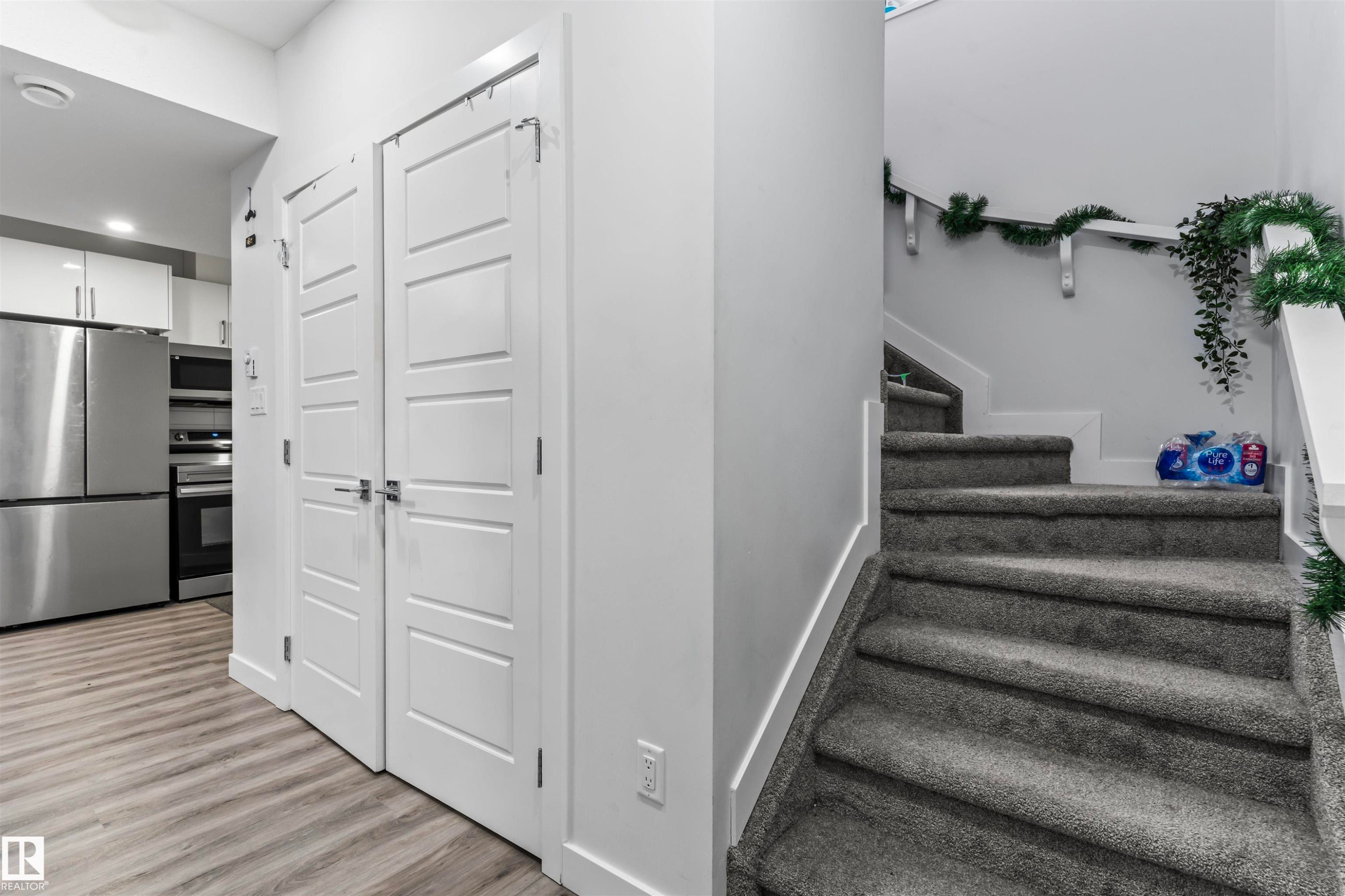Contemporary interior featuring light-toned wood-finish flooring - 8046 Kiriak Link, Edmonton, AB - Indoor Photo Showing Other Room