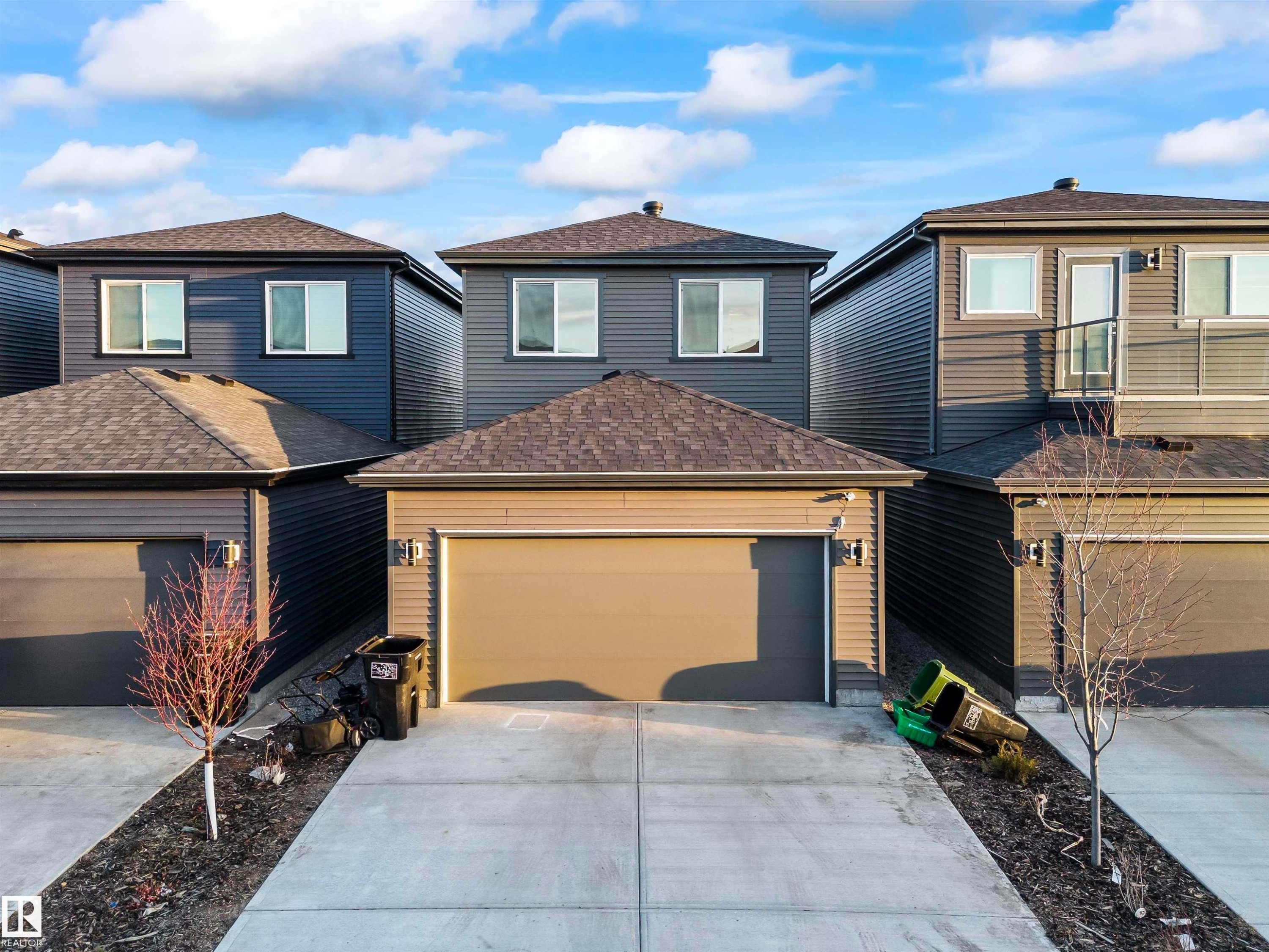 Modern exterior featuring horizontal siding in a dark tone - 8046 Kiriak Link, Edmonton, AB - Outdoor
