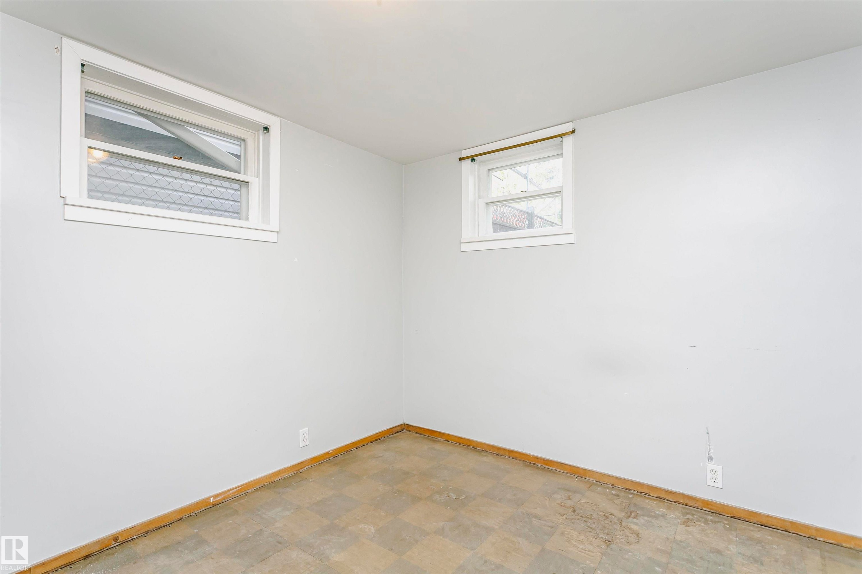 Room with light gray painted walls and a checkerboard-patterned floor - 10035 81 Avenue Nw, Edmonton, AB - Indoor Photo Showing Other Room