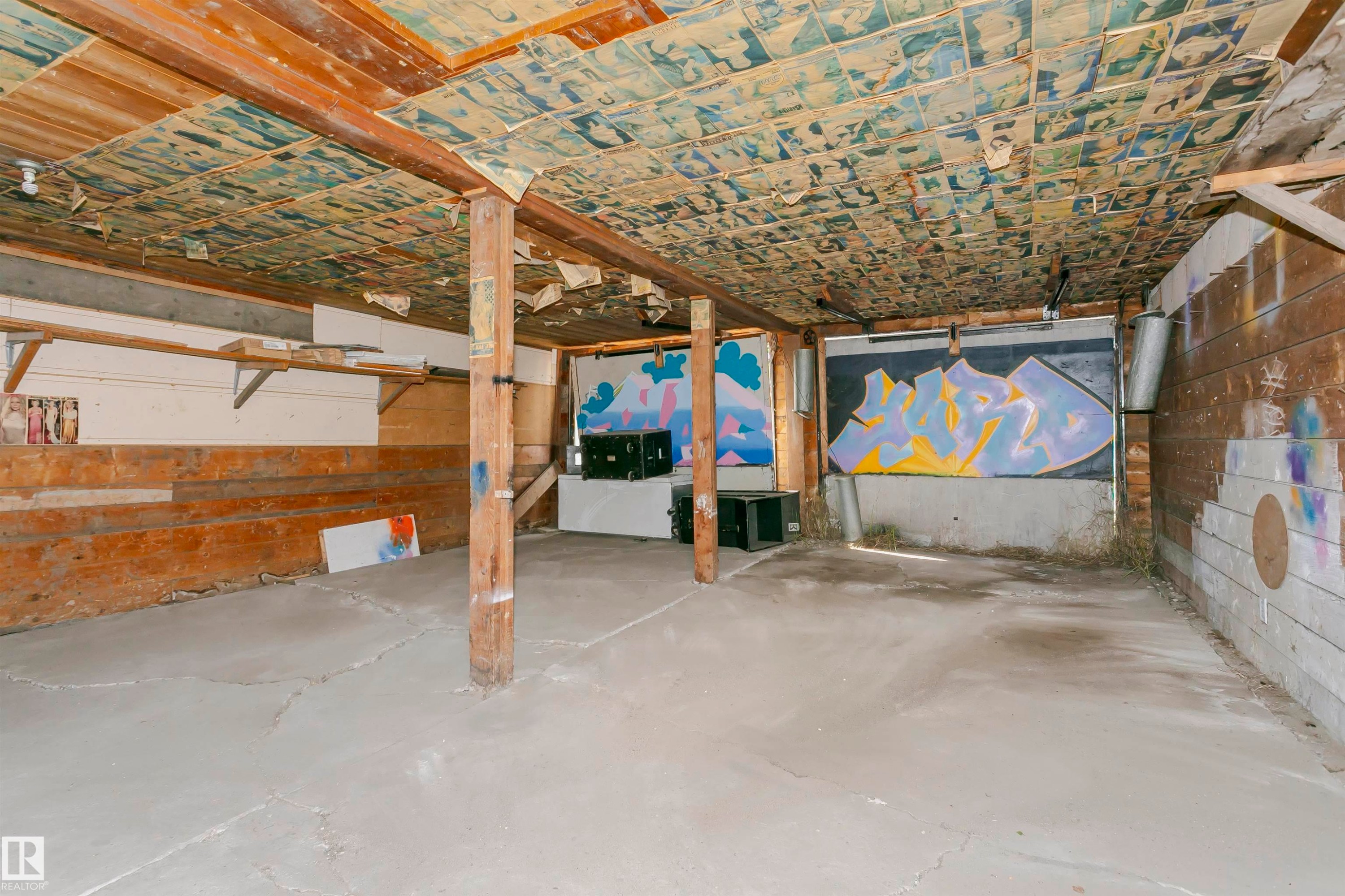 Spacious unfinished basement with exposed wood ceiling beams and concrete flooring - 10035 81 Avenue Nw, Edmonton, AB - Indoor Photo Showing Garage