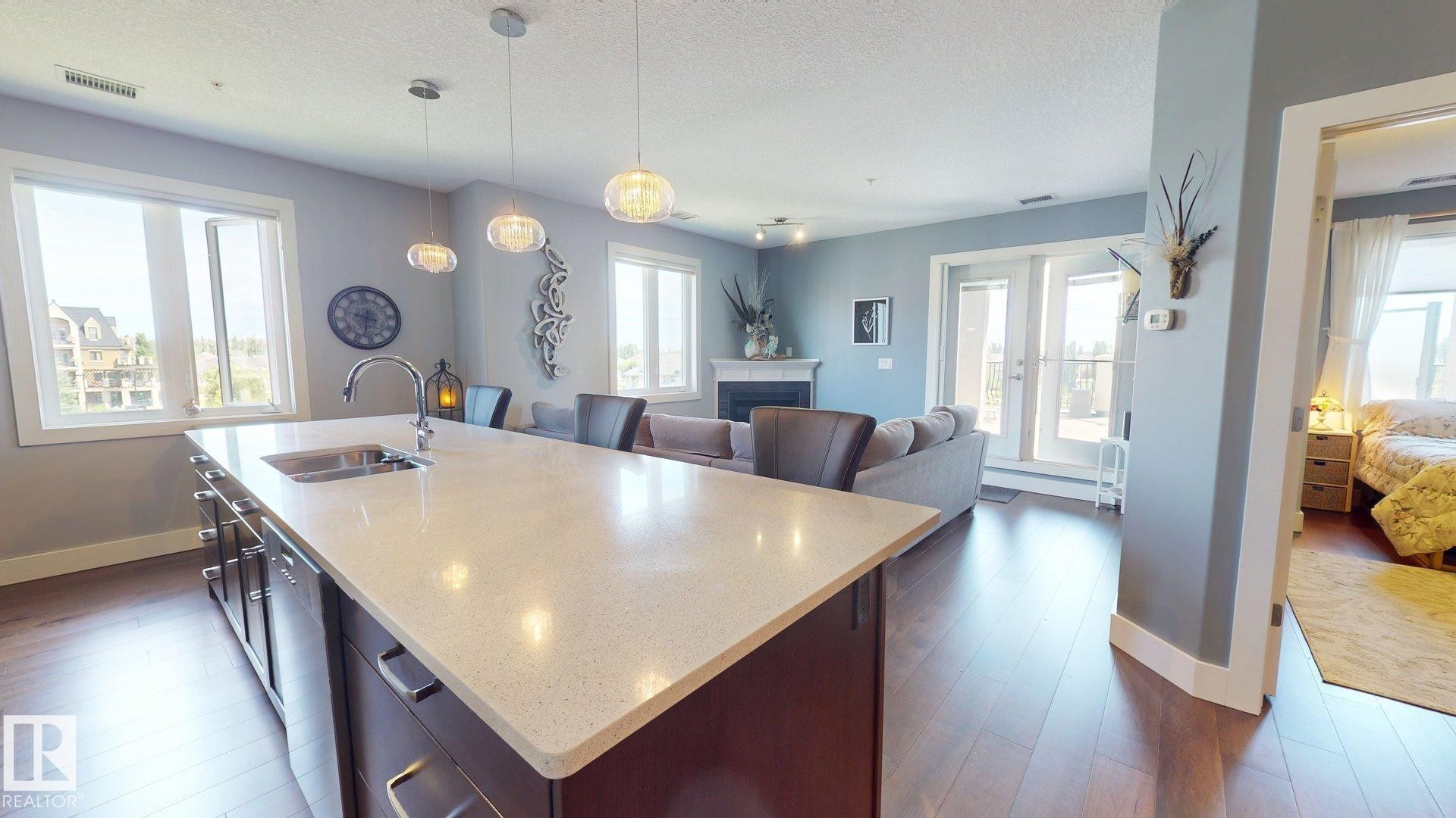 #355 6079 Maynard Wy Nw, Edmonton, AB - Indoor Photo Showing Other Room