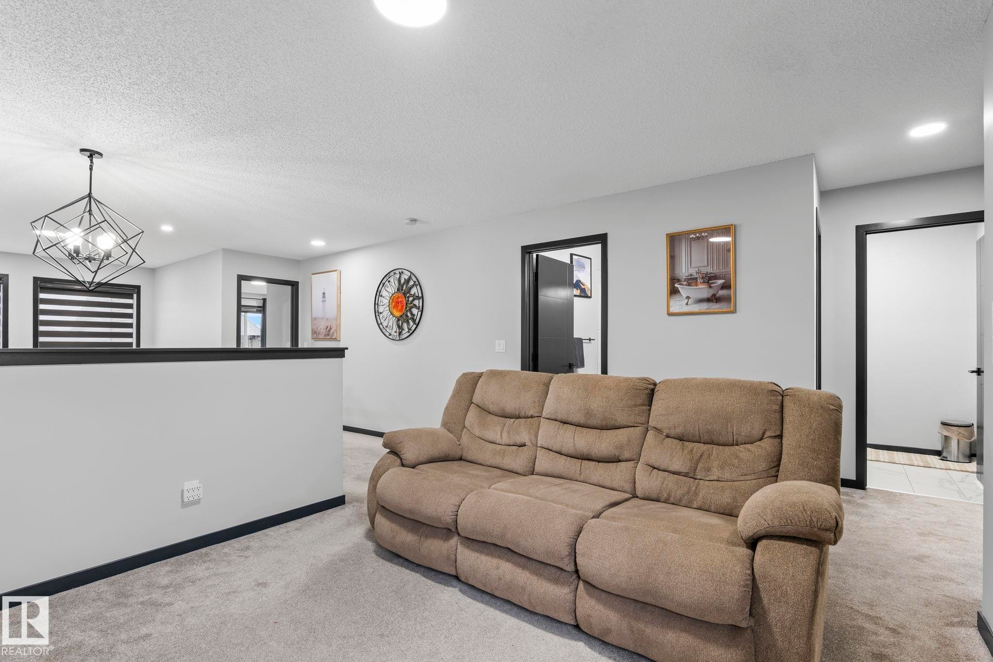 Open concept area with light gray walls and contrasting dark trim - 5110 23A Ave Sw, Edmonton, AB