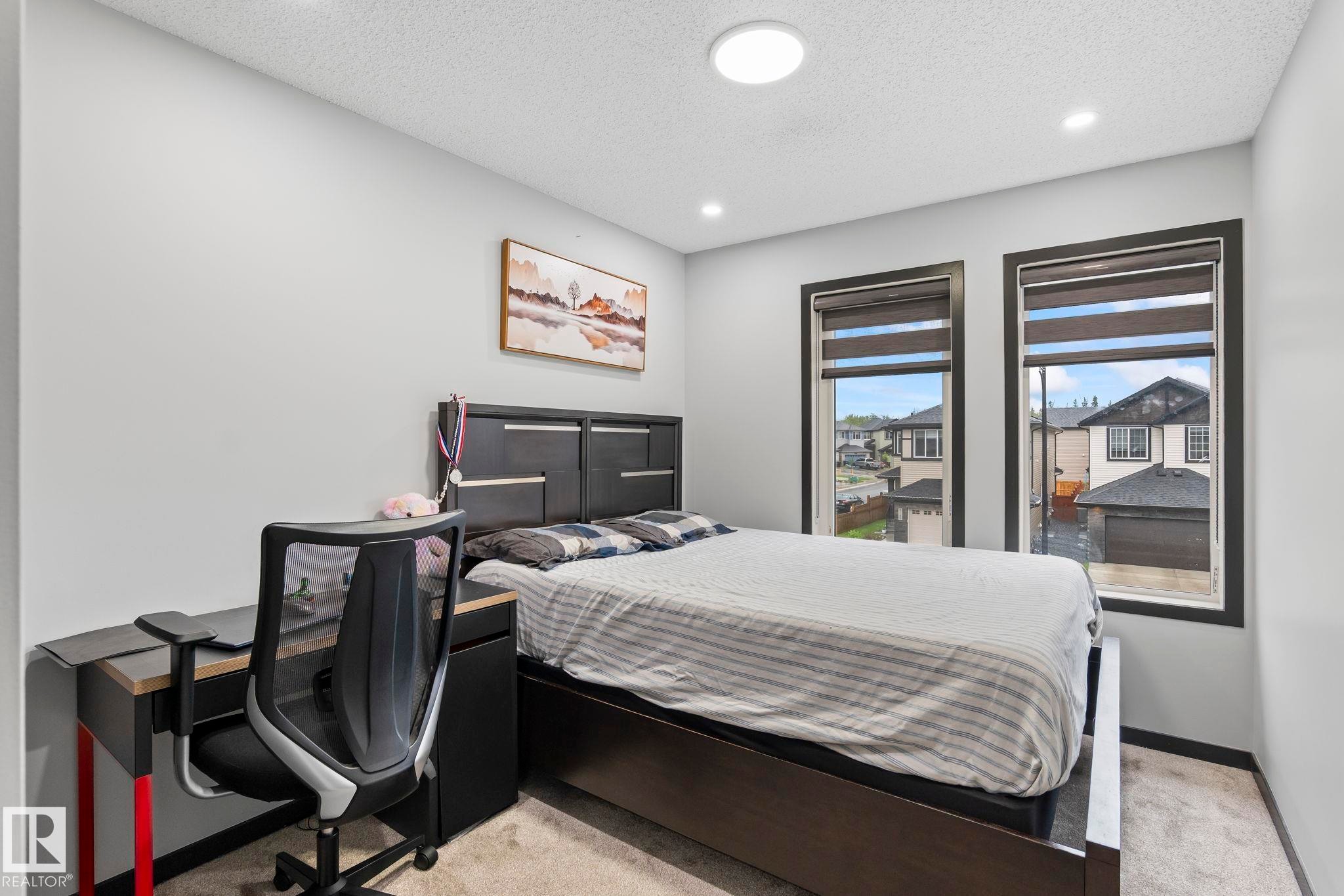 Neutral wall paint with carpet flooring - 5110 23A Ave Sw, Edmonton, AB
