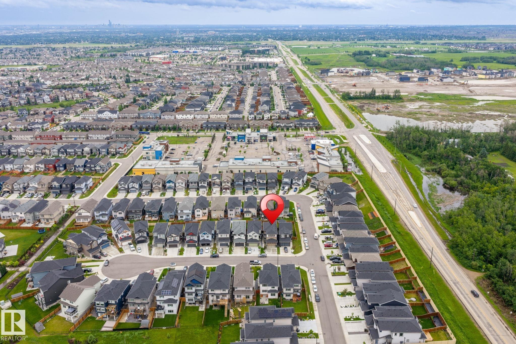 Aerial perspective showcasing a residential neighborhood with varied housing styles - 5110 23A Ave Sw, Edmonton, AB