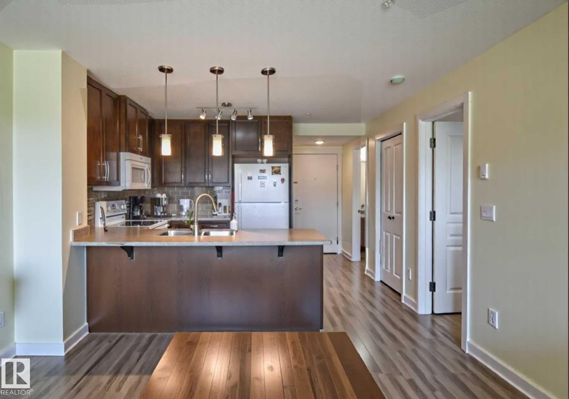#210 3670 139 Av Nw, Edmonton, AB - Indoor Photo Showing Kitchen With Double Sink