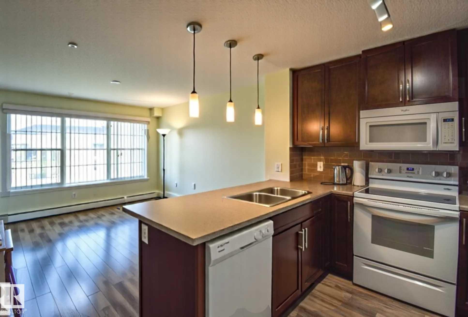 #210 3670 139 Av Nw, Edmonton, AB - Indoor Photo Showing Kitchen With Double Sink