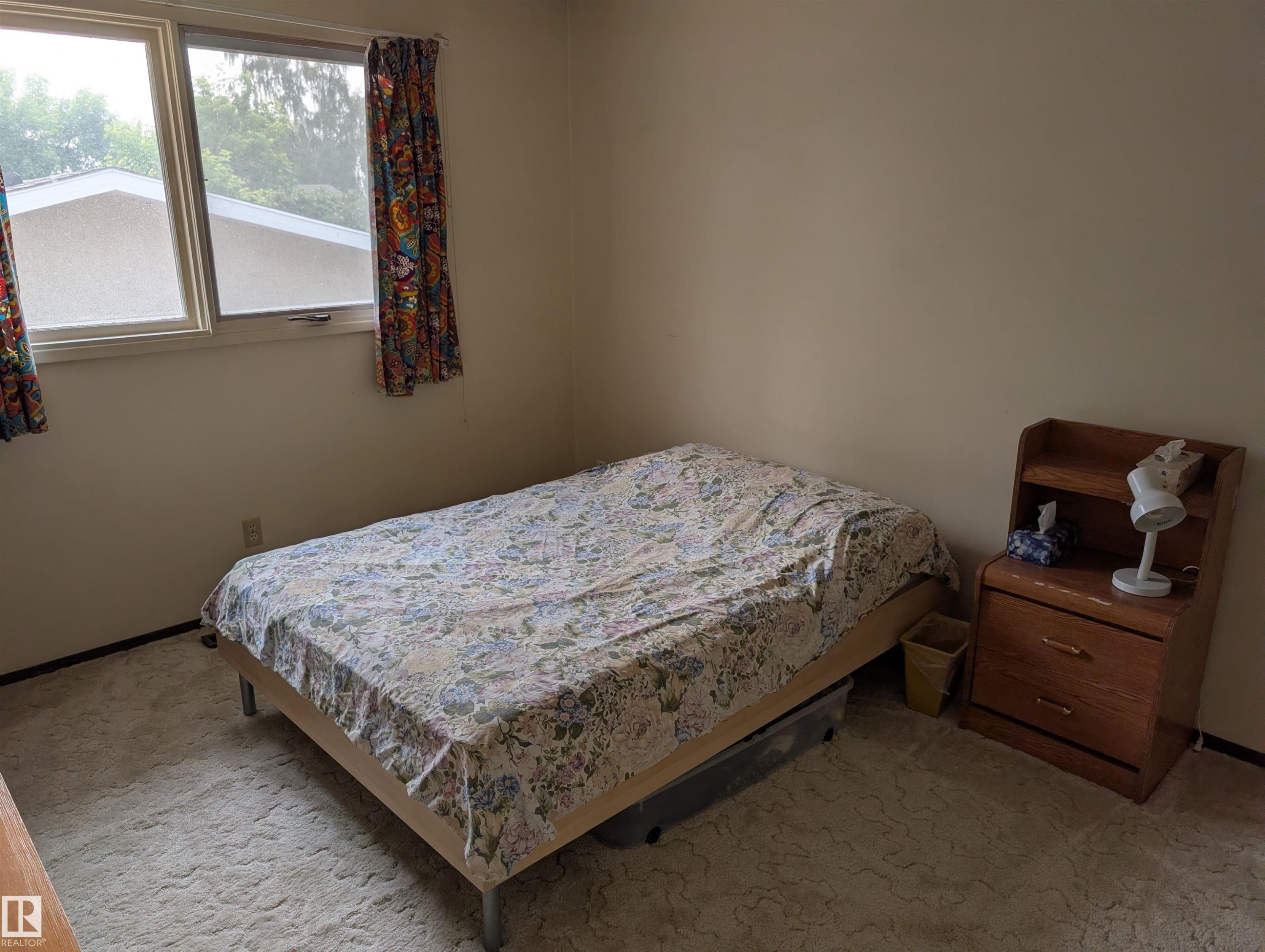 Wall-to-wall carpeting in a neutral tone, complemented by a muted wall color - 6415 147 Avenue, Edmonton, AB