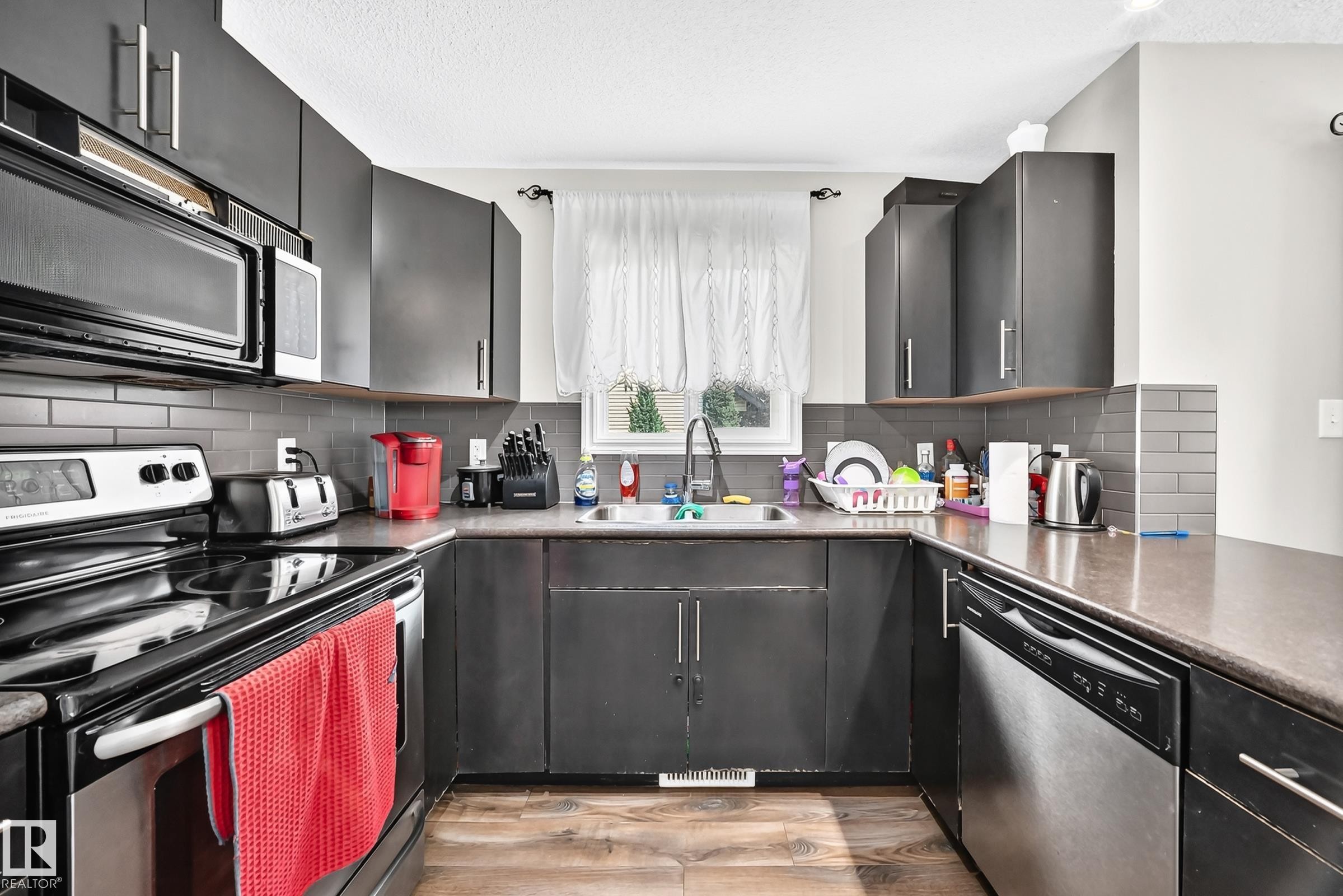 #21 8716 179 Av Nw, Edmonton, AB - Indoor Photo Showing Kitchen With Double Sink