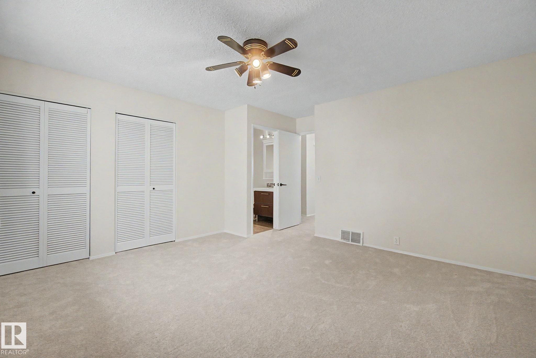 Bright room featuring neutral carpeting and light-toned walls - 170 Westridge Rd, Edmonton, AB - Indoor Photo Showing Other Room