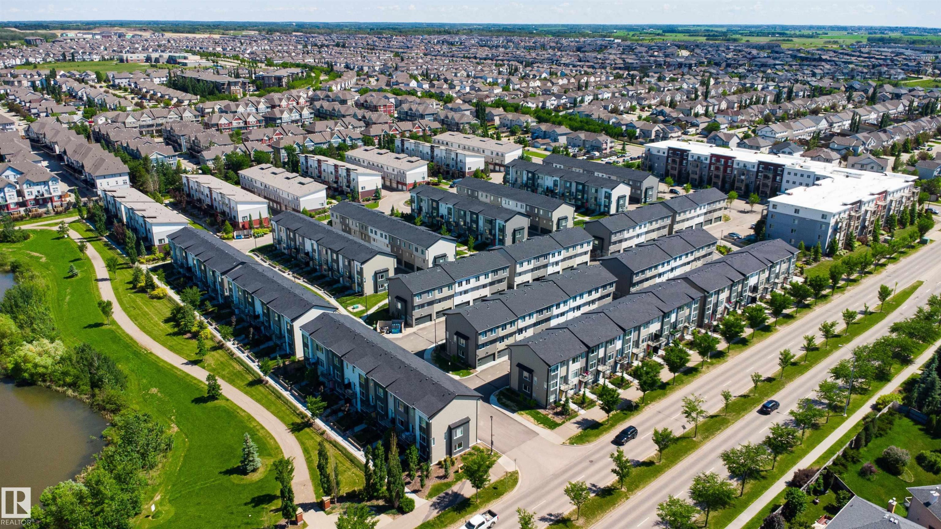 Modern townhome development featuring contemporary architecture and dark-pitched roofs - 170 804 Welsh Drive, Edmonton, AB