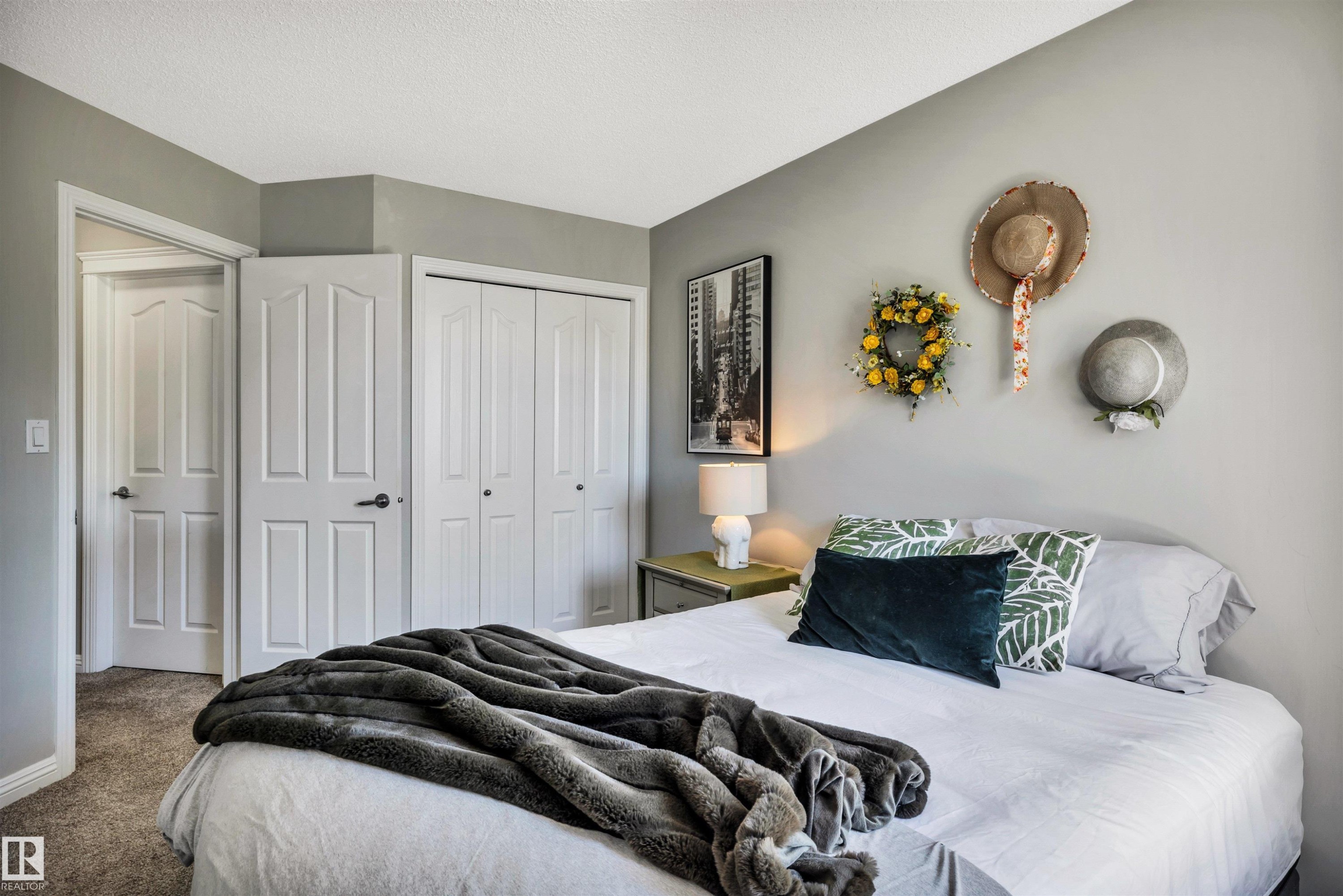 Bedroom with light grey walls and neutral carpet flooring - 9804 145 Avenue, Edmonton, AB
