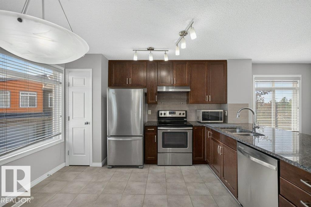 #39 7503 Getty Ga Nw, Edmonton, AB - Indoor Photo Showing Kitchen With Stainless Steel Kitchen With Double Sink