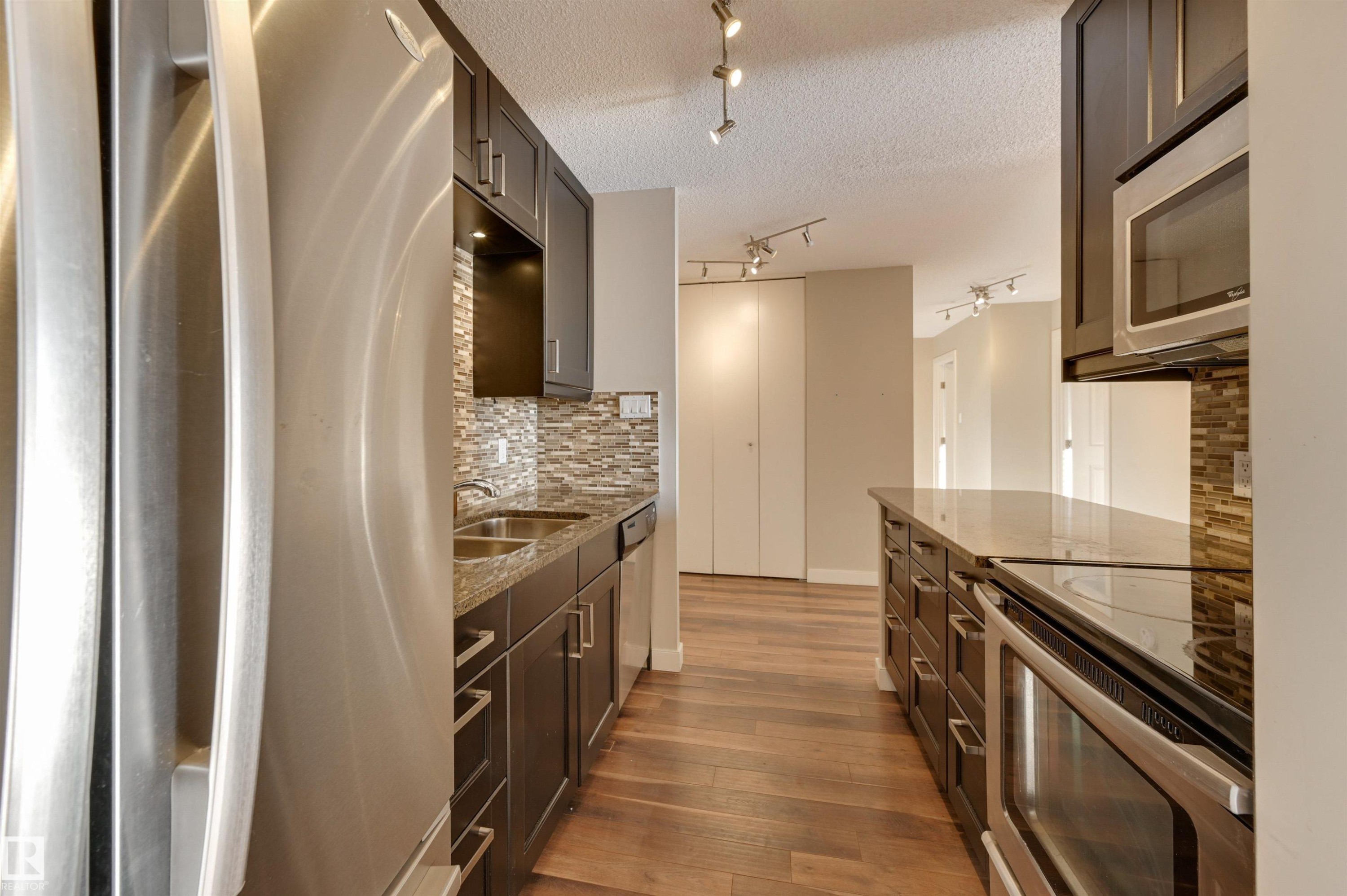 #406 12141 Jasper Av Nw, Edmonton, AB - Indoor Photo Showing Kitchen With Double Sink With Upgraded Kitchen