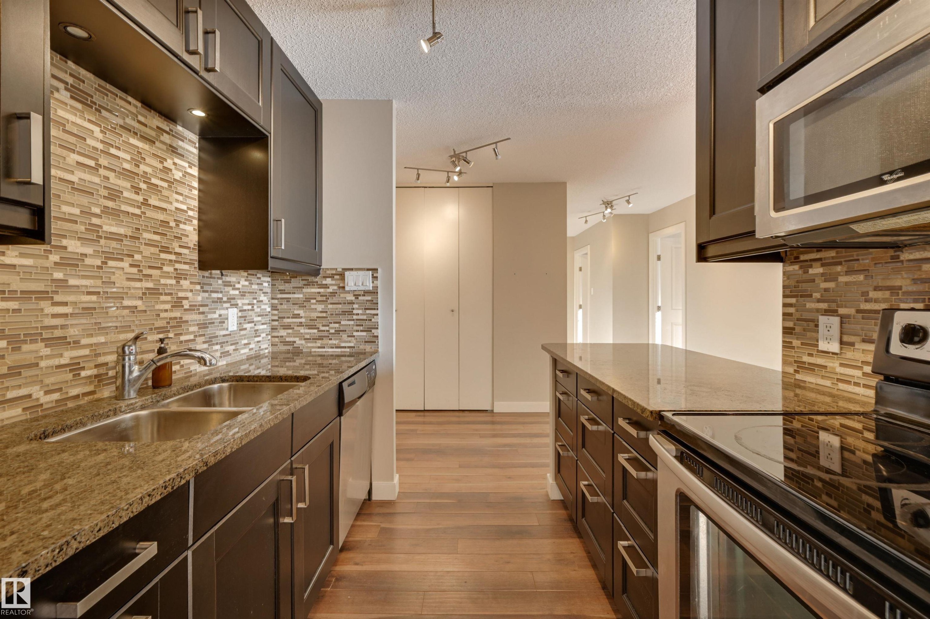 #406 12141 Jasper Av Nw, Edmonton, AB - Indoor Photo Showing Kitchen With Double Sink With Upgraded Kitchen