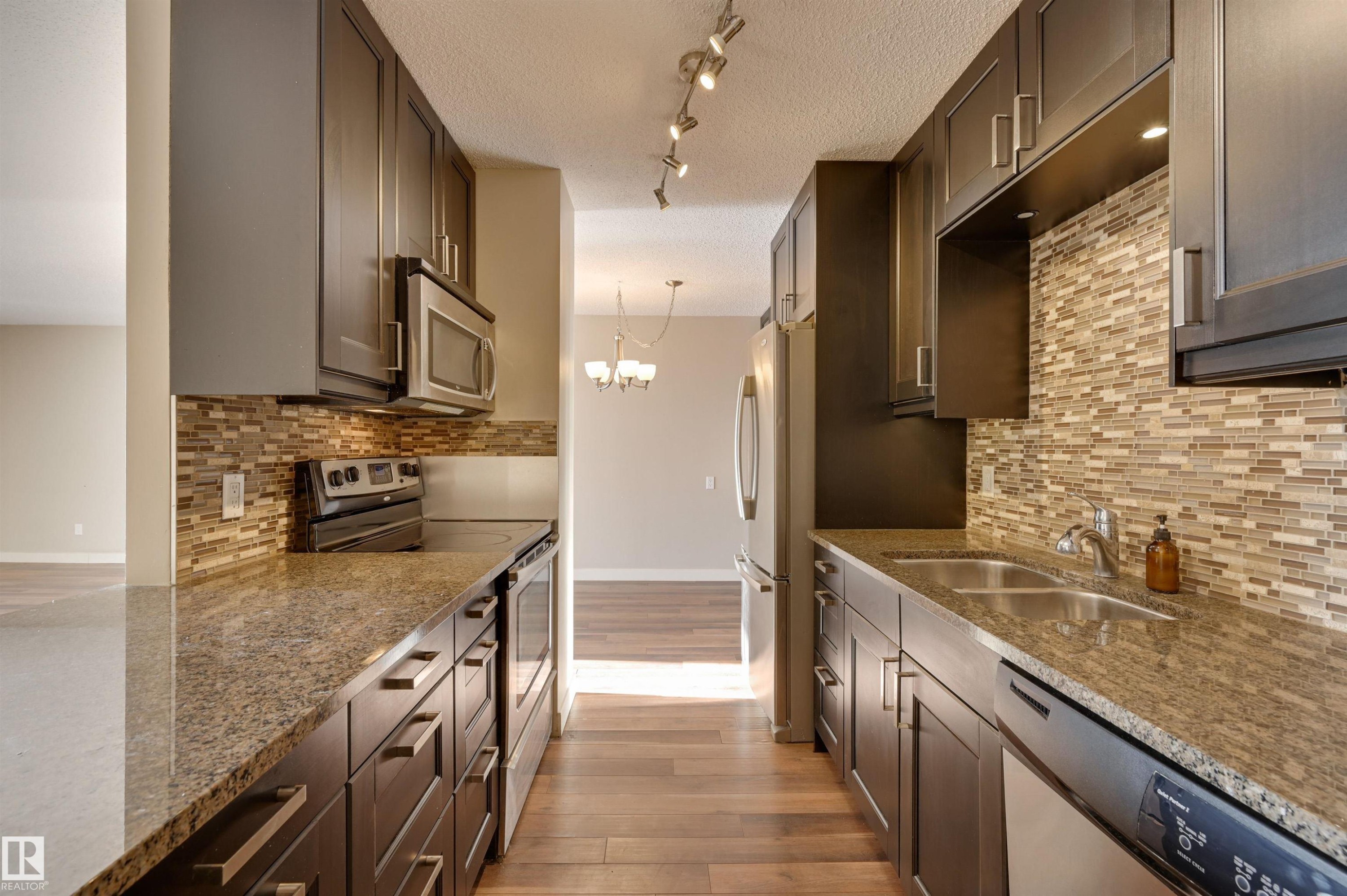 #406 12141 Jasper Av Nw, Edmonton, AB - Indoor Photo Showing Kitchen With Double Sink With Upgraded Kitchen