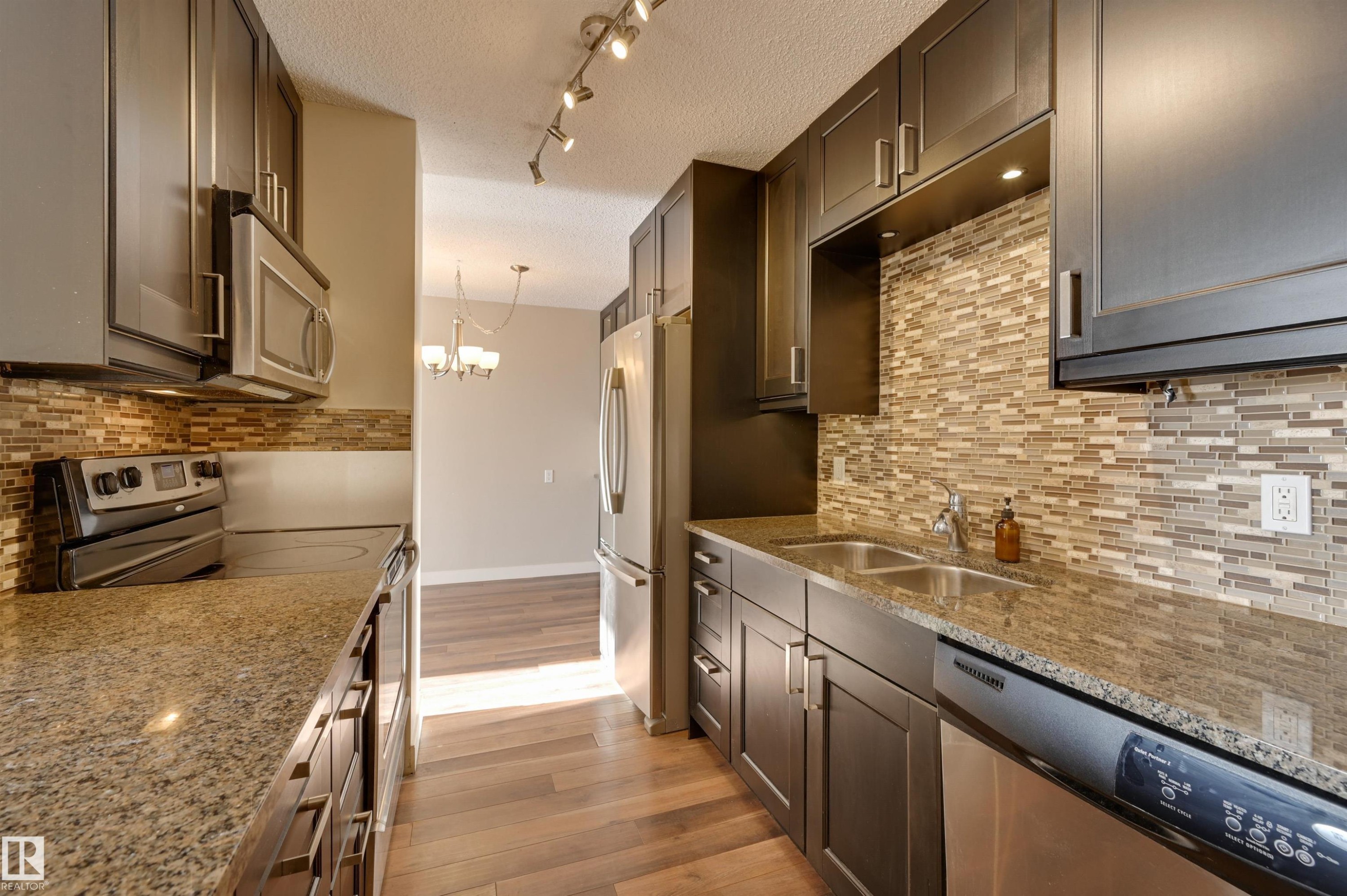 #406 12141 Jasper Av Nw, Edmonton, AB - Indoor Photo Showing Kitchen With Double Sink With Upgraded Kitchen