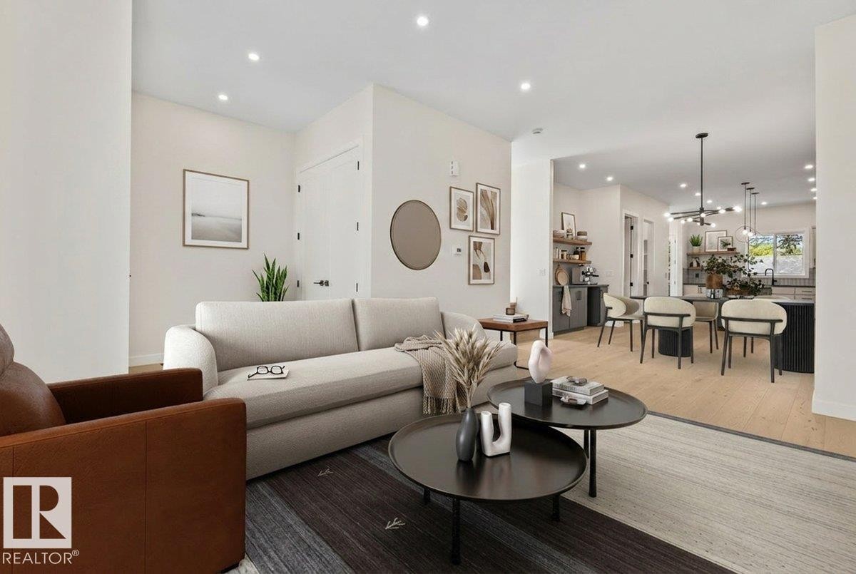 Open-concept living space featuring recessed lighting, light wood-finish flooring, and a neutral color palette - 10932 132 Street, Edmonton, AB - Indoor Photo Showing Living Room