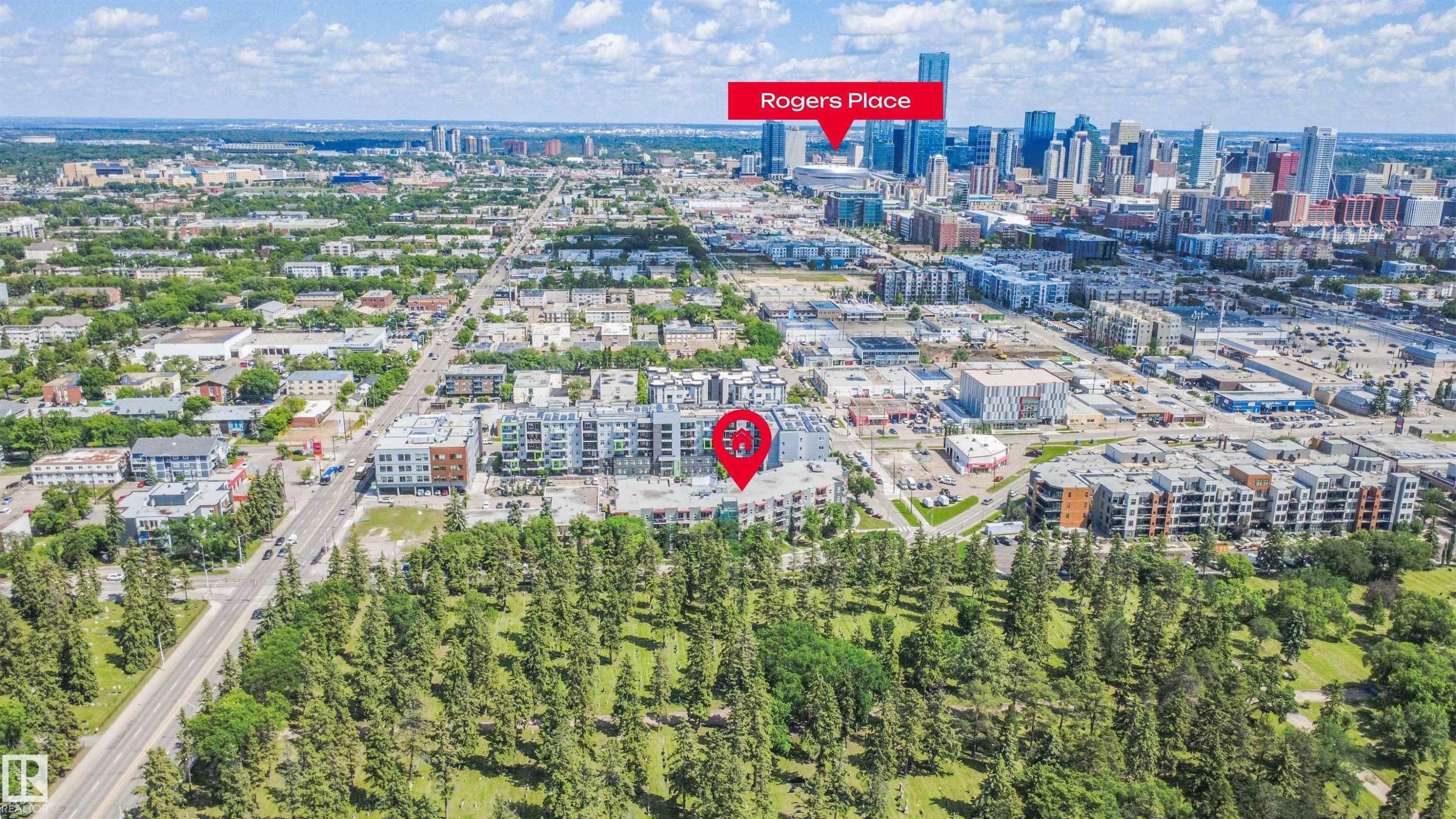 Aerial perspective showcasing a vibrant urban landscape with a prominent downtown skyline - #209 10611 117 St Nw, Edmonton, AB - Outdoor With View