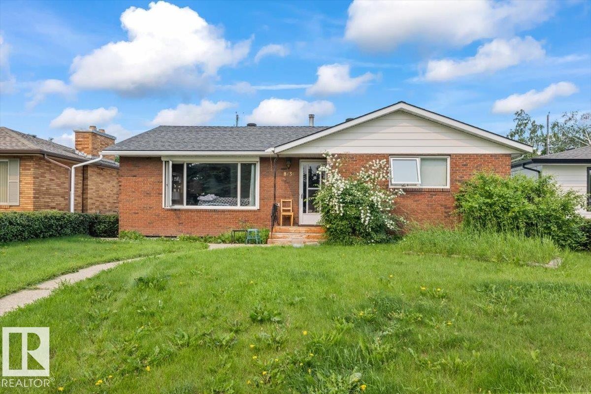 Brick facade home with white siding gable - 8736 72 Street Nw, Edmonton, AB - Outdoor