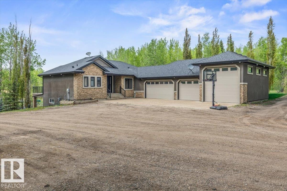 Contemporary exterior featuring a stone and stucco facade - #6 2406 Twp Road 540, Rural Lac Ste. Anne County, AB - Outdoor