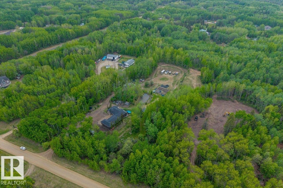 Expansive wooded acreage featuring multiple structures, a pond, and cleared areas - #6 2406 Twp Road 540, Rural Lac Ste. Anne County, AB - Outdoor With View