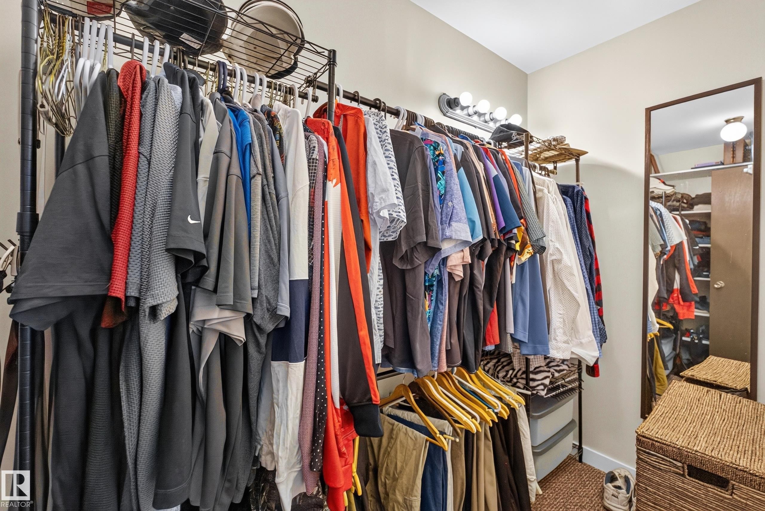 Configurable closet system featuring multiple hanging rods and integrated shelving - 12062 157 Avenue, Edmonton, AB