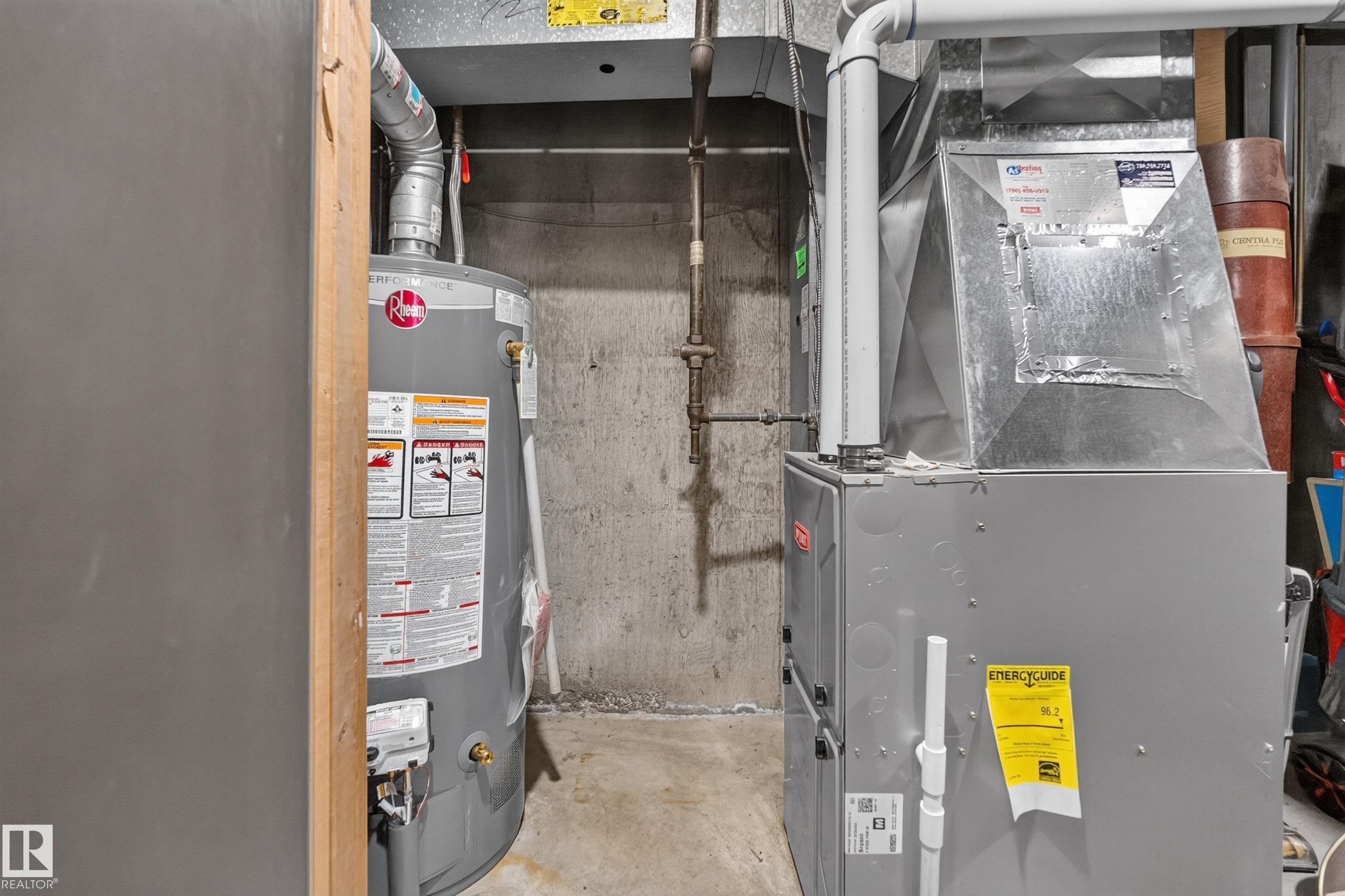 Utility area featuring a water heater and furnace unit - 12062 157 Avenue, Edmonton, AB
