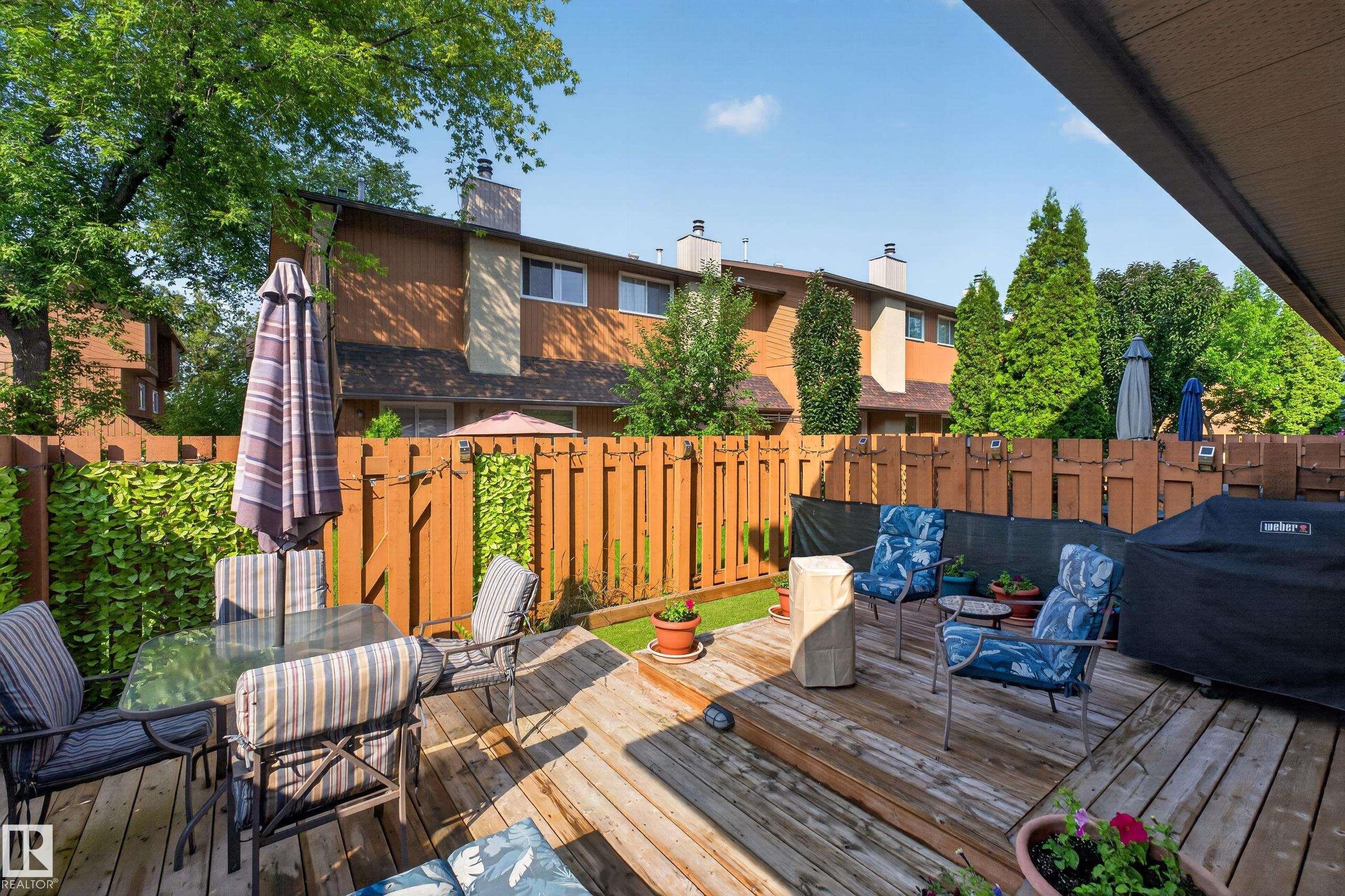 Spacious outdoor deck featuring natural wood planks - 12062 157 Avenue, Edmonton, AB